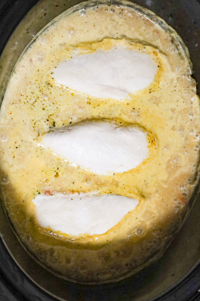 chicken breasts after cooking in a cream soup mixture in a crock pot
