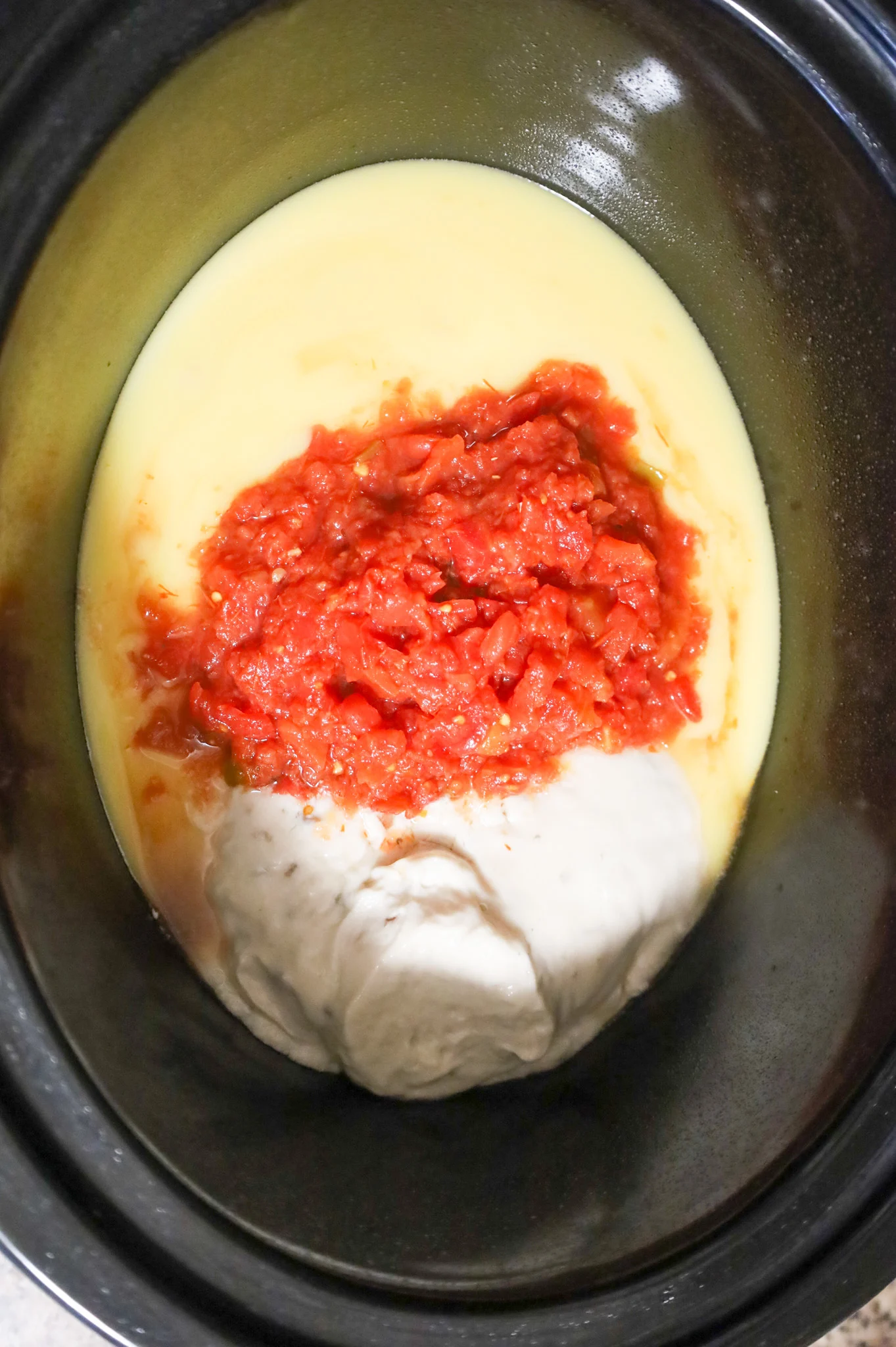 rotel diced tomatoes on top of cream soups in a crock pot