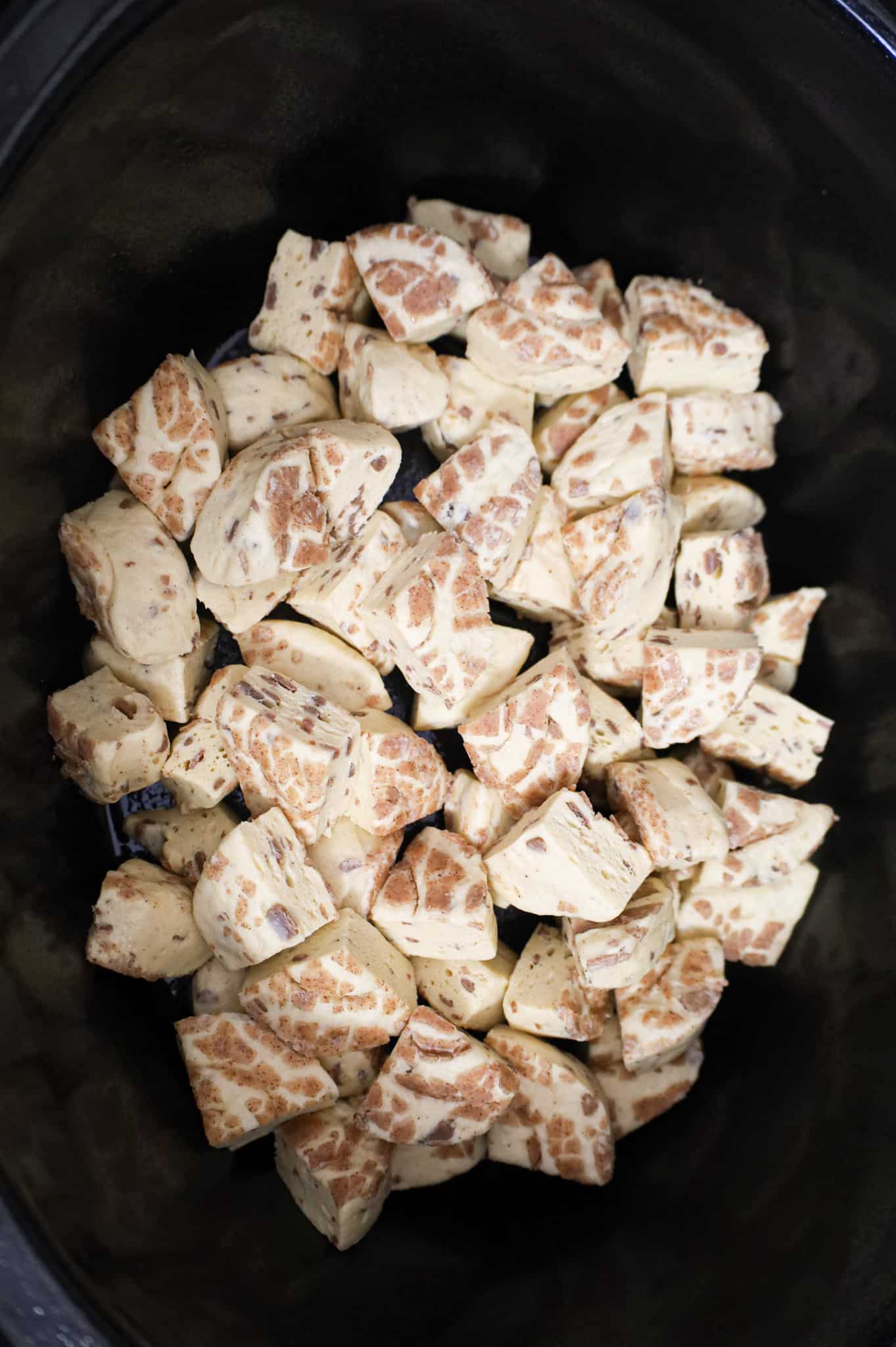 quarters of Pillsbury cinnamon roll dough in a Crock Pot