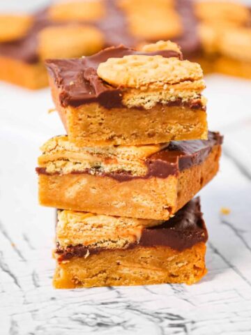 Nutter Butter Bars are a delicious dessert recipe with a layer of chewy peanut butter blondies topped with creamy chocolate and Nutter Butter cookies.