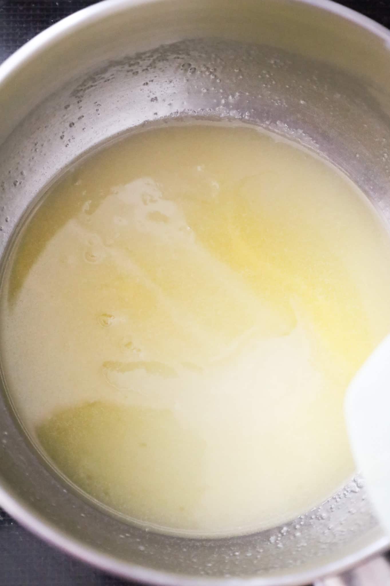 butter and sugar being stirred together in a saucepan