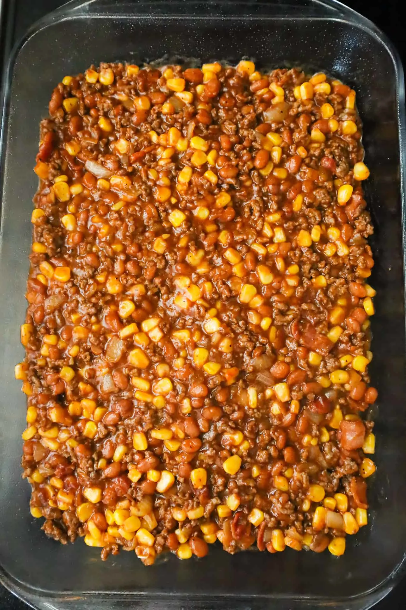 ground beef, corn and bean mixture in a baking dish