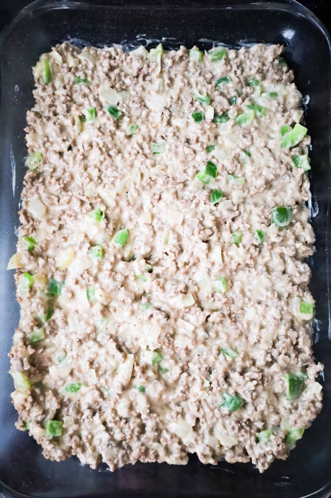 ground beef and cream of mushroom soup mixture in a baking dish
