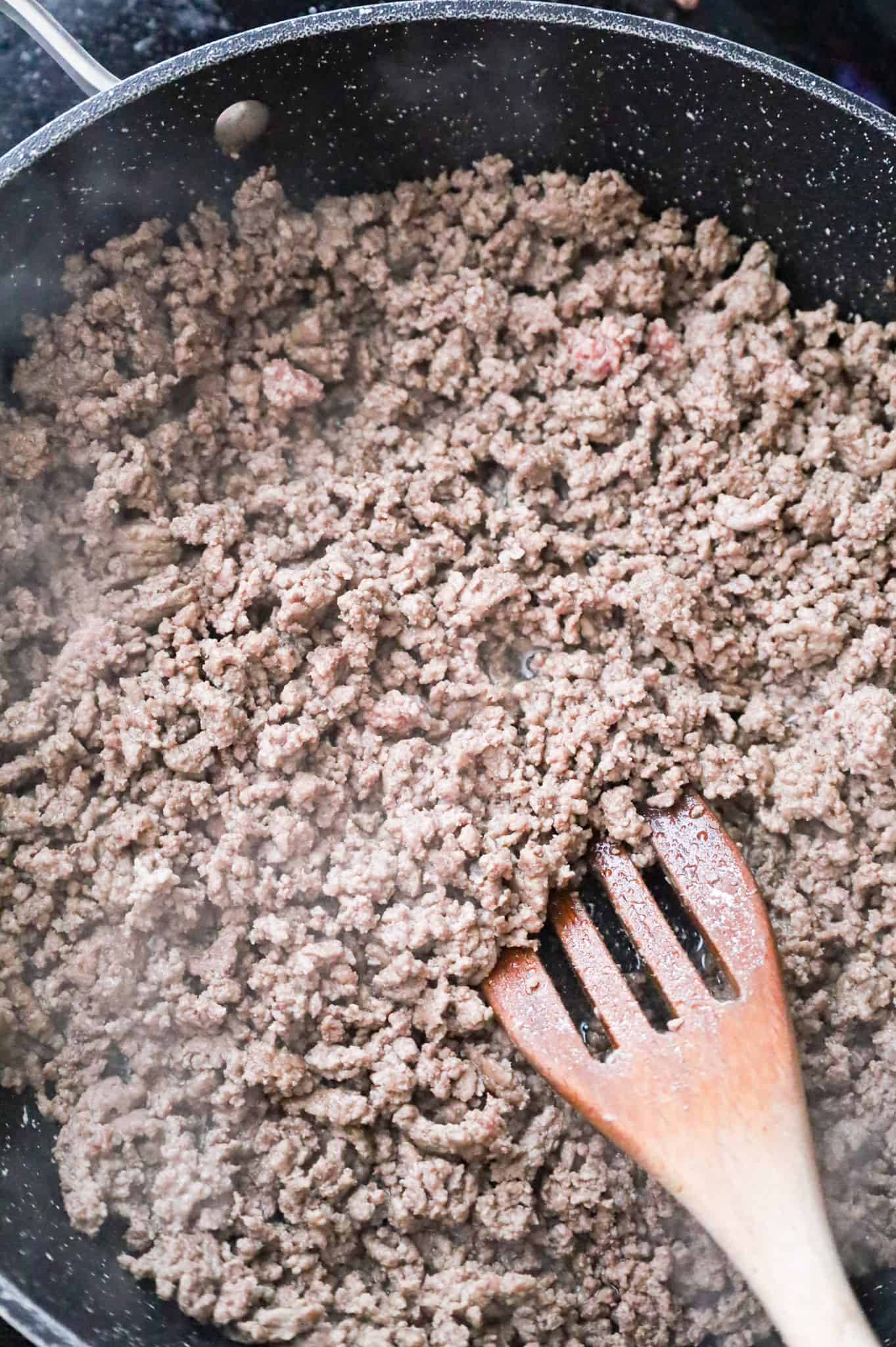 ground beef cooking in a skillet