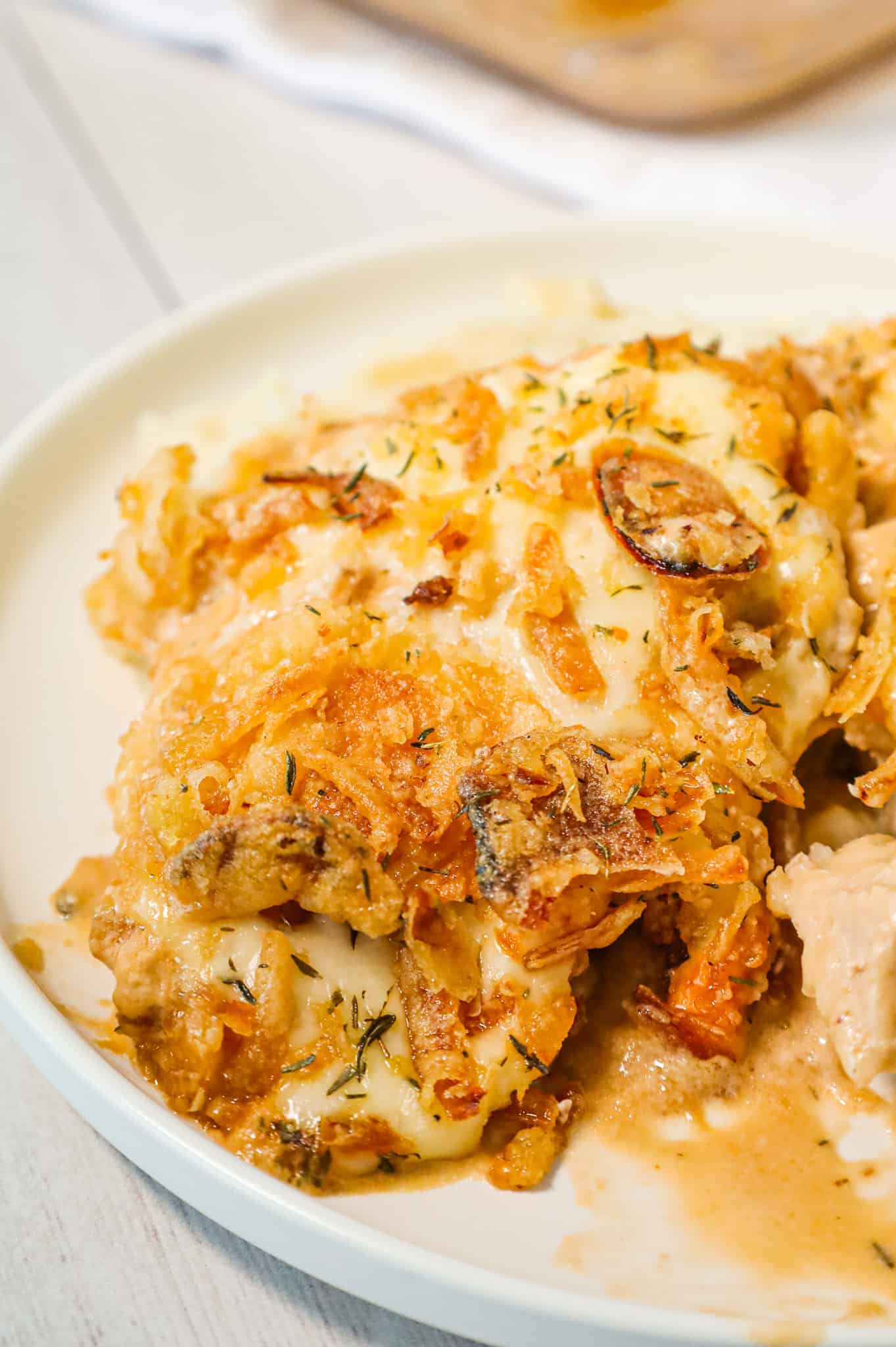 French Onion Pork Chops are an easy baked pork chop recipe loaded with sour cream, onion soup mix, provolone cheese and crispy fried onions.