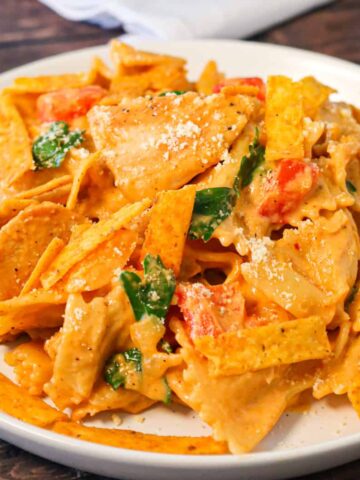 Spicy Chicken Chipotle Pasta is a delicious creamy pasta recipe loaded with diced peppers, parmesan cheese, chipotle pepper sauce and chicken breast chunks.