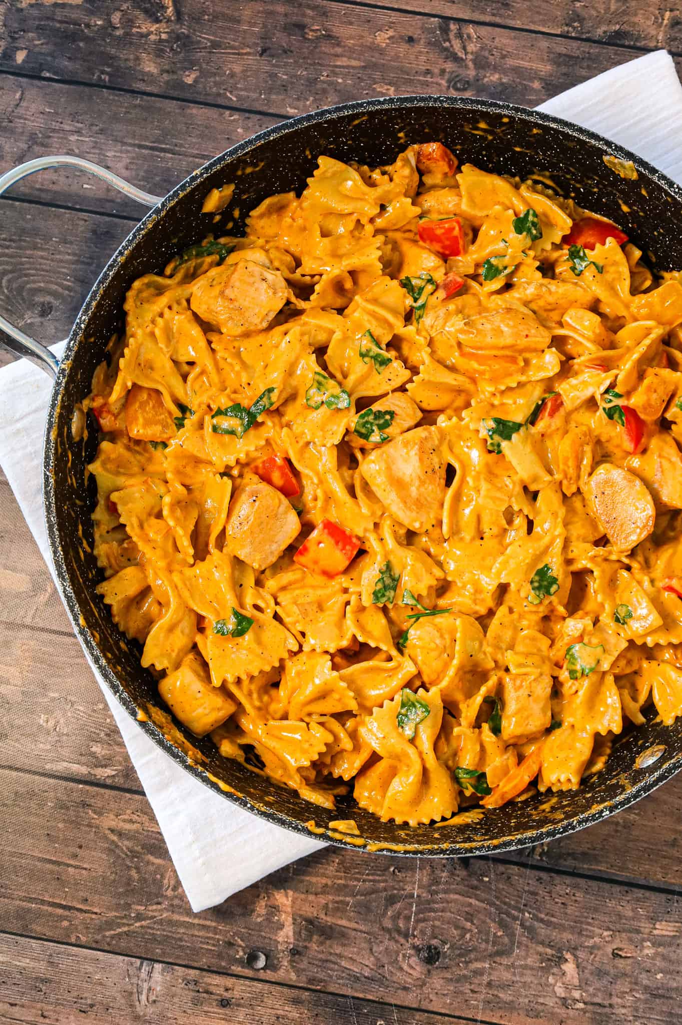 Spicy Chicken Chipotle Pasta is a delicious creamy pasta recipe loaded with diced peppers, parmesan cheese, chipotle pepper sauce and chicken breast chunks.