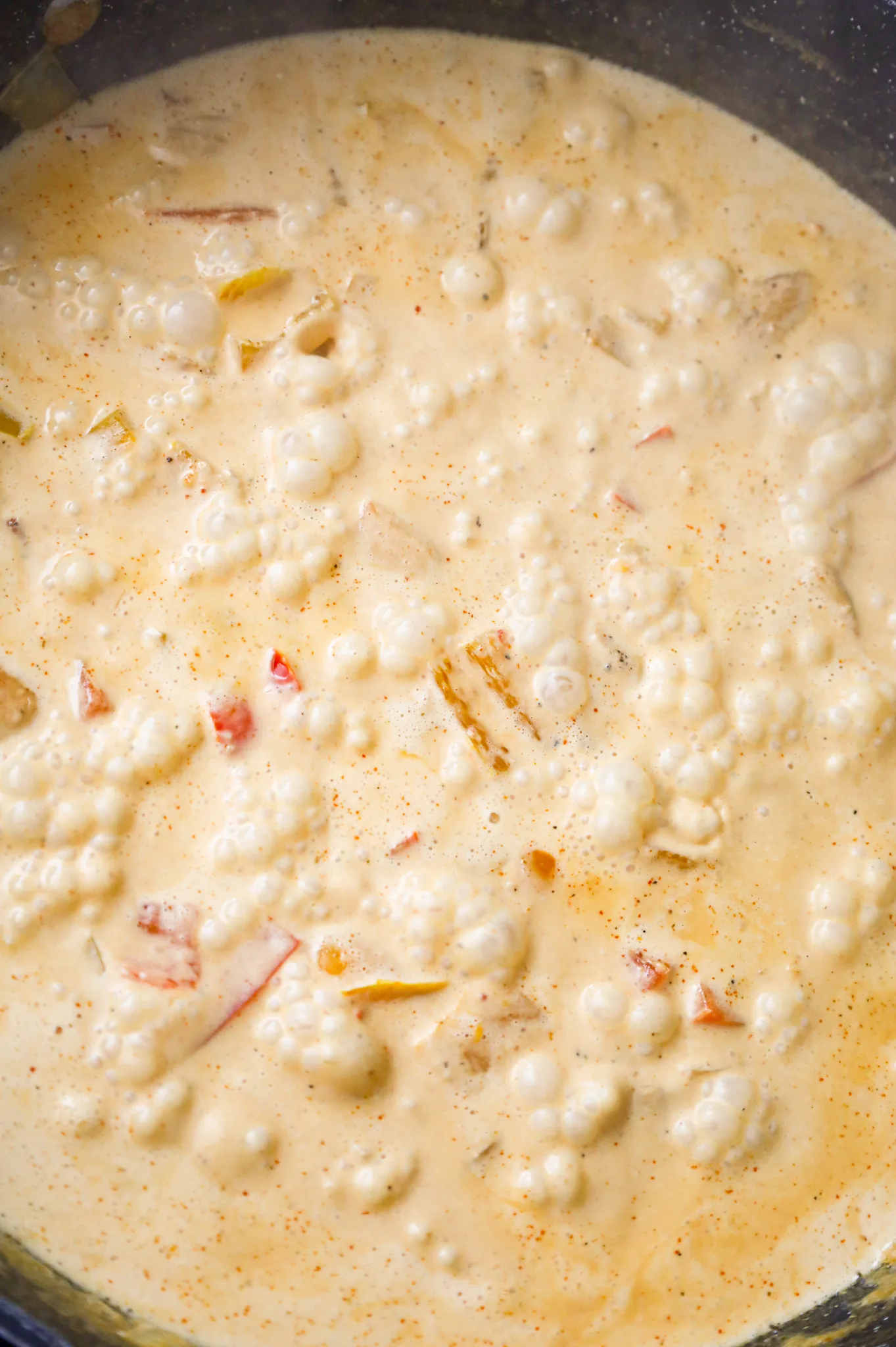 creamy chipotle sauce boiling in a skillet