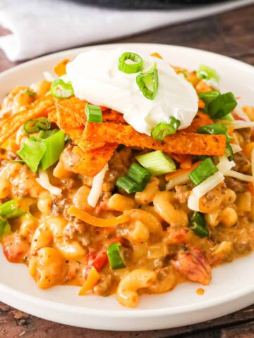 Taco Mac and Cheese is an easy pasta recipe loaded with ground beef, taco seasoning and Rotel diced tomatoes and tossed in a creamy cheese sauce.
