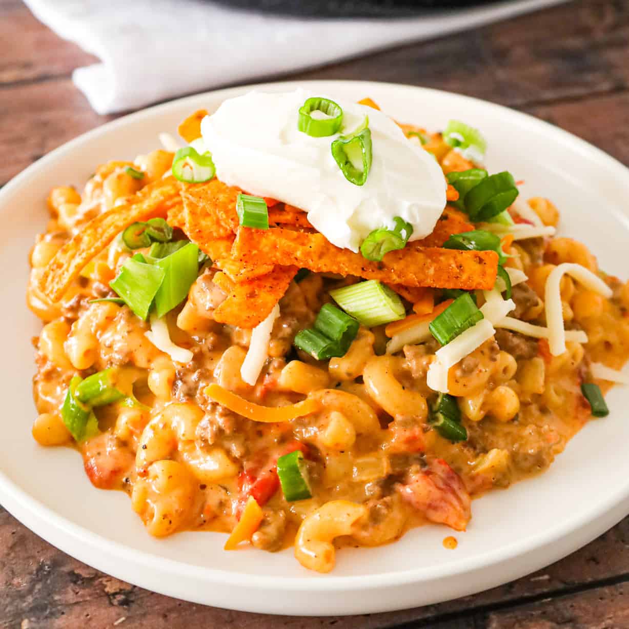 Taco Mac and Cheese is an easy pasta recipe loaded with ground beef, taco seasoning and Rotel diced tomatoes and tossed in a creamy cheese sauce.