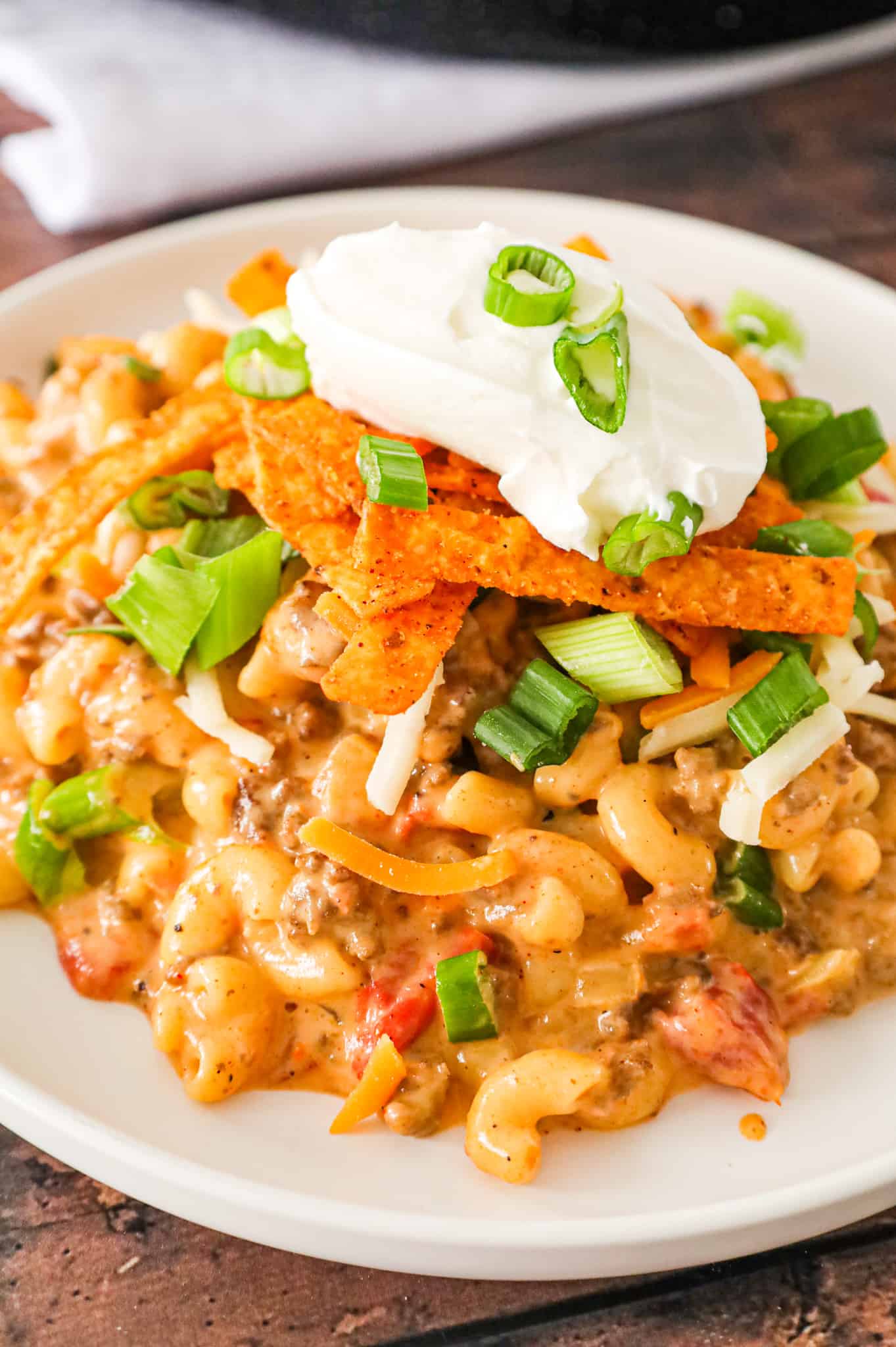 Taco Mac and Cheese is an easy pasta recipe loaded with ground beef, taco seasoning and Rotel diced tomatoes and tossed in a creamy cheese sauce.