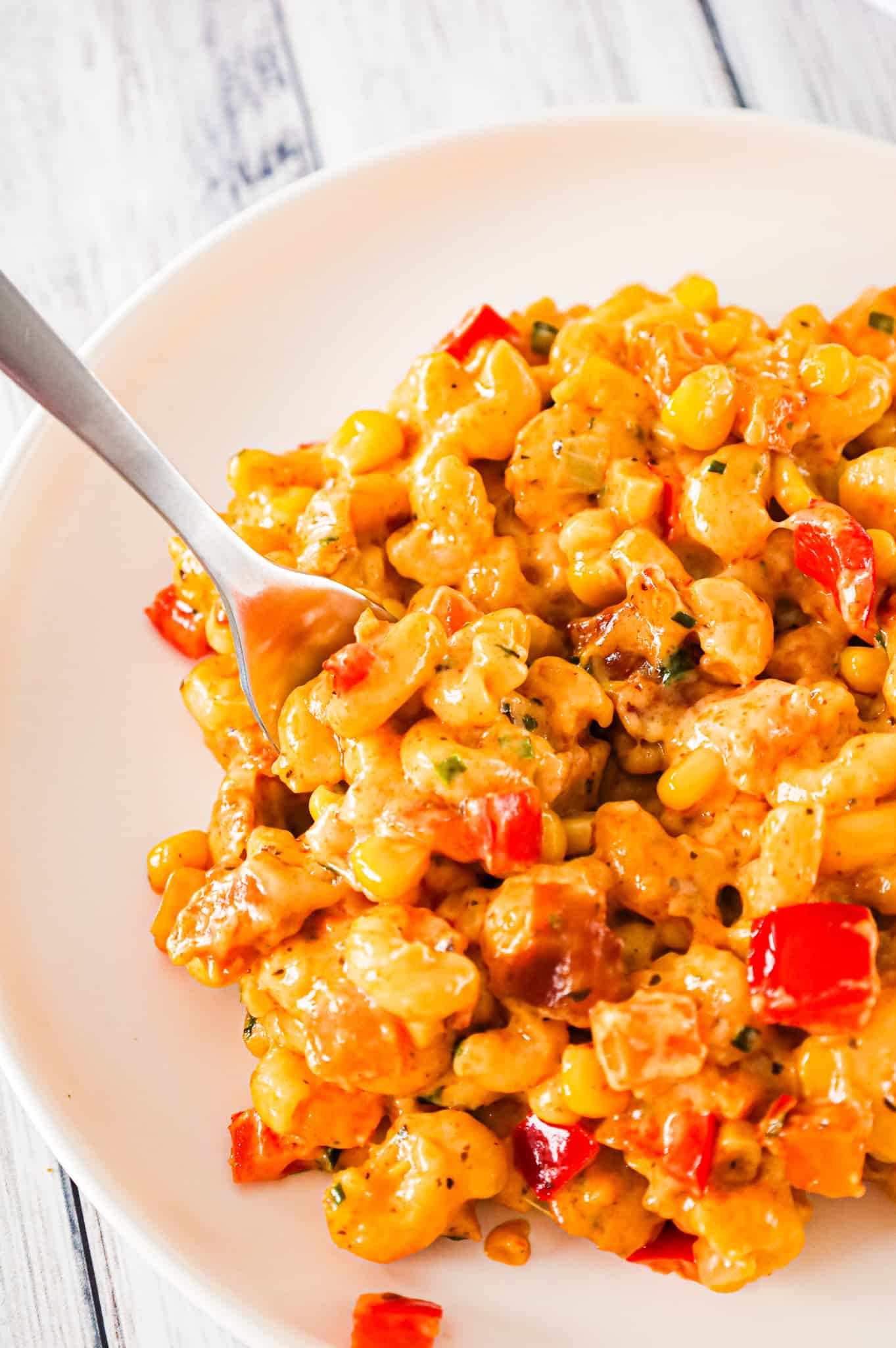 Cajun Mac and Cheese is a flavourful pasta recipe loaded with bacon, sweet potato, red bell peppers, Cajun seasoning, cheddar and Monterey Jack.