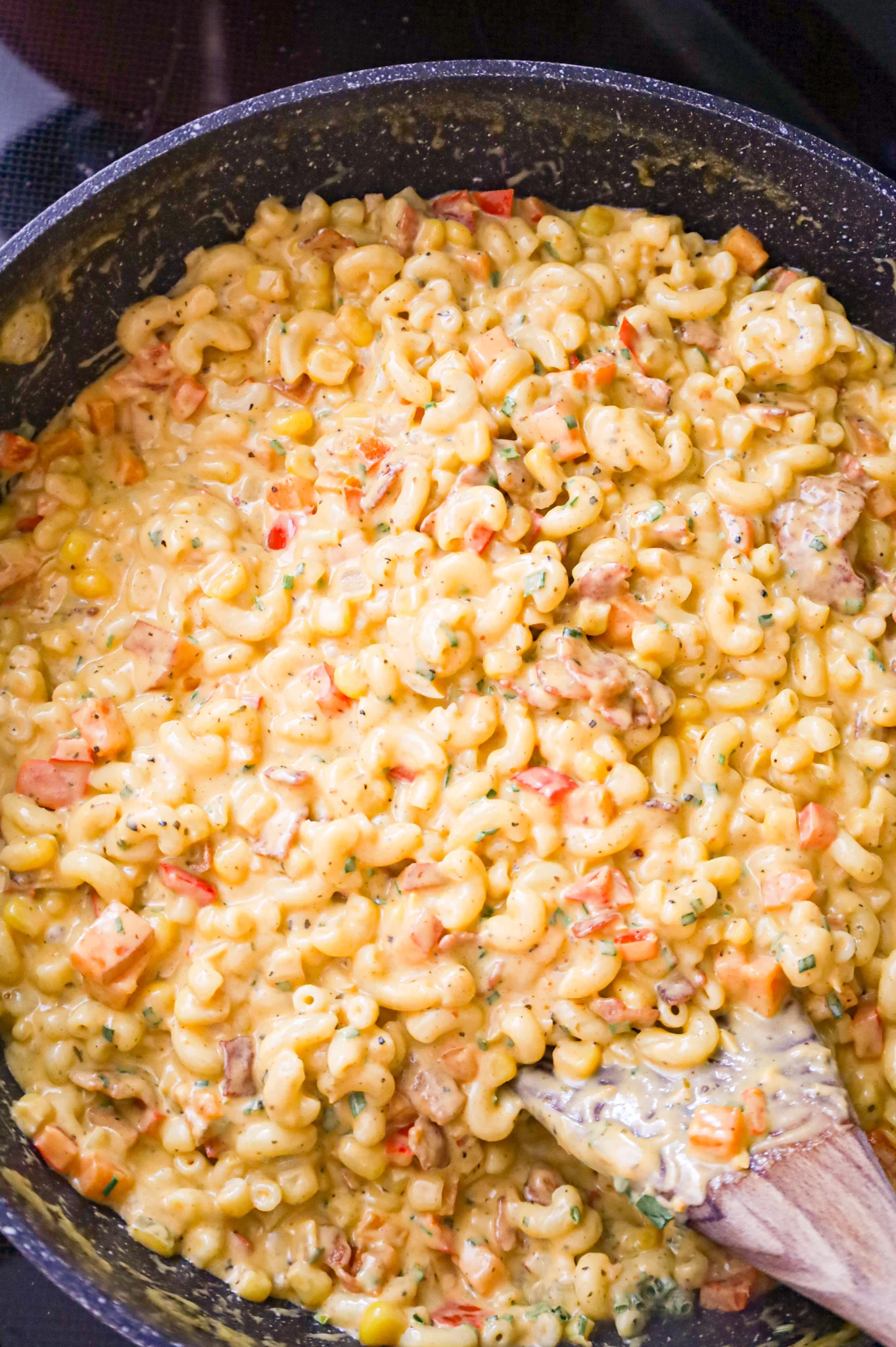 macaroni noodles coated in creamy Cajun sauce in a skillet