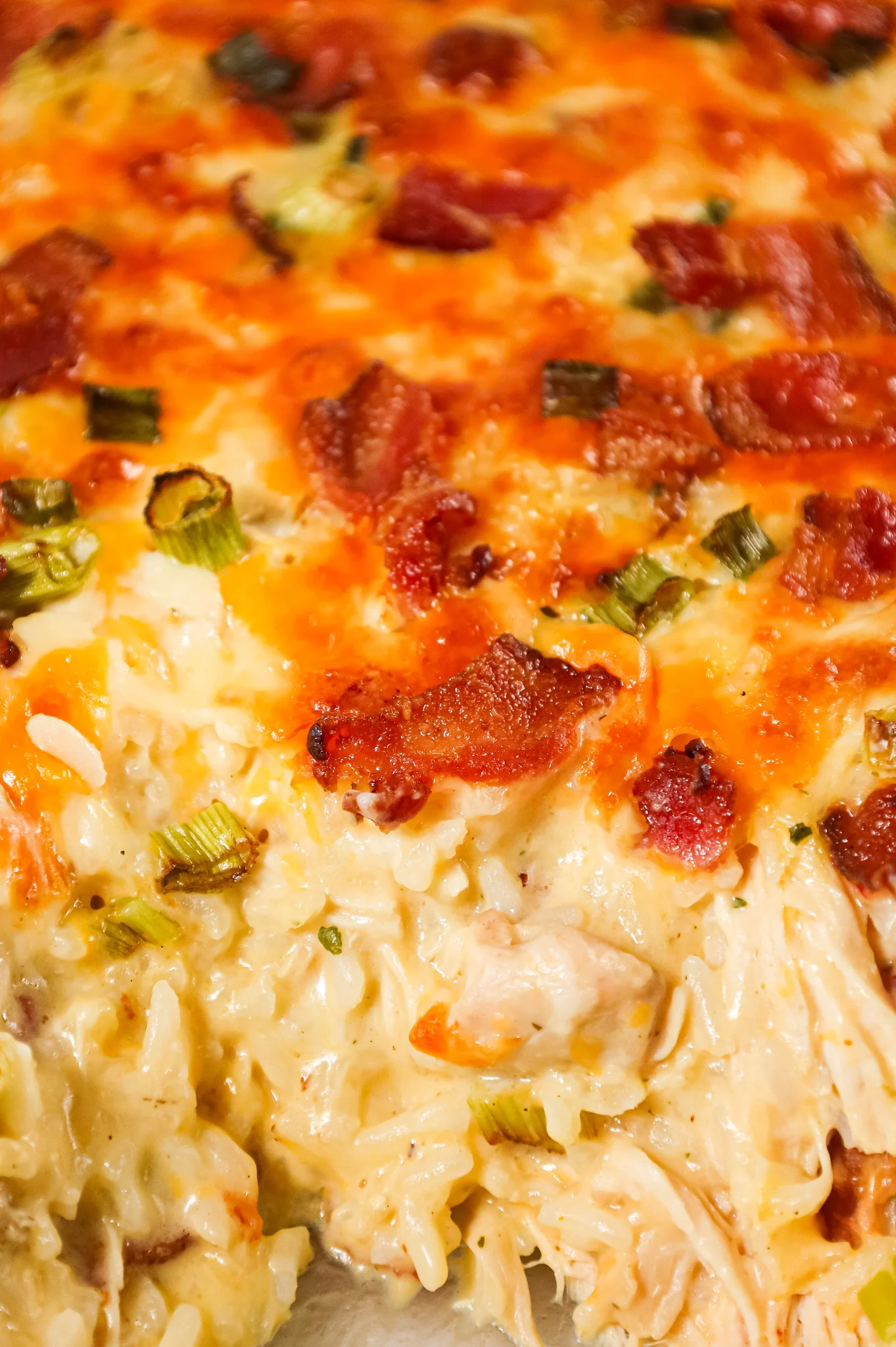 Chicken Bacon Ranch Casserole is a hearty chicken and rice casserole loaded with cream of chicken soup, cream of bacon soup, cheddar soup, ranch dressing mix, chopped bacon and shredded cheese.