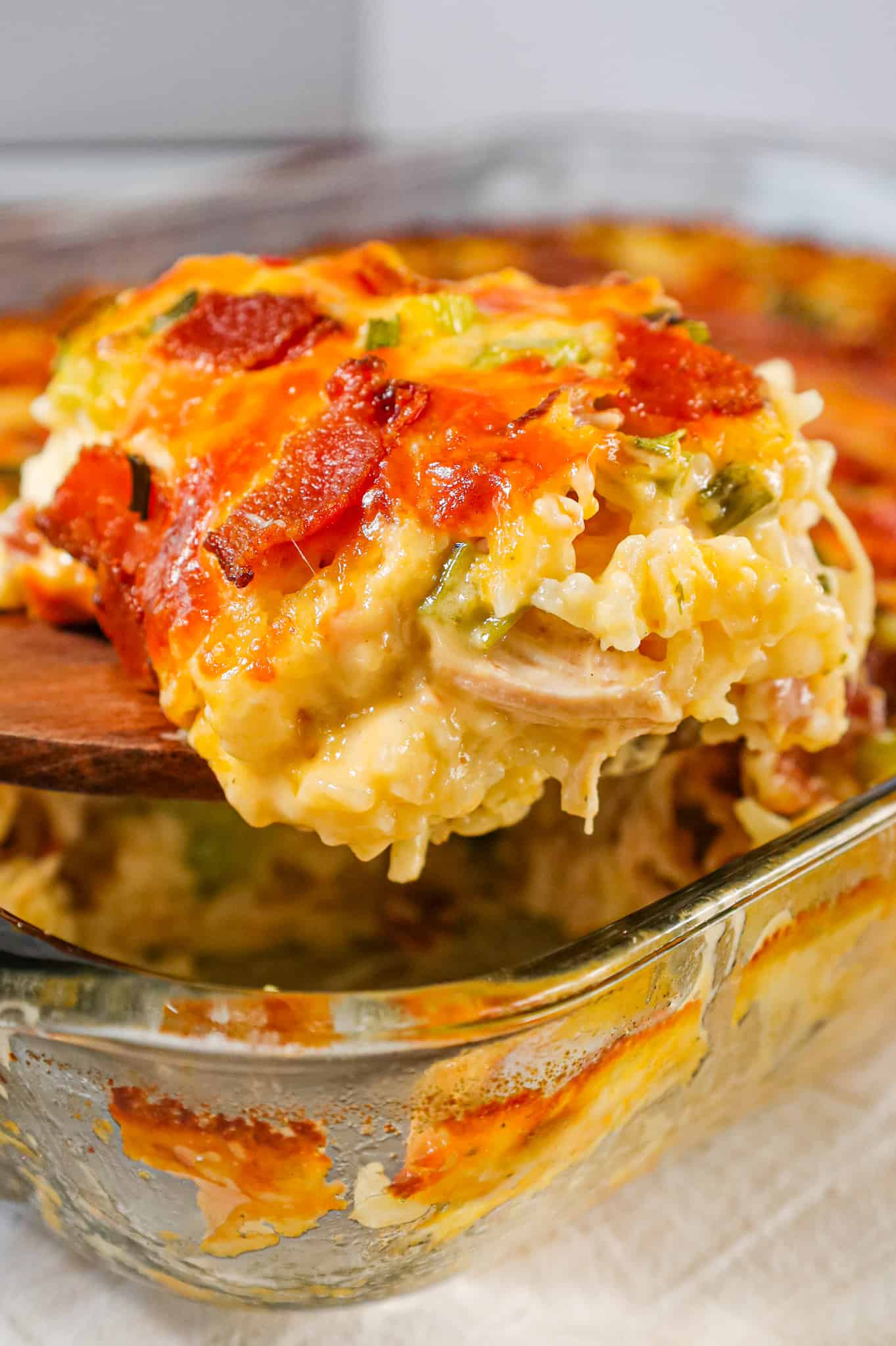 Chicken Bacon Ranch Casserole is a hearty chicken and rice casserole loaded with cream of chicken soup, cream of bacon soup, cheddar soup, ranch dressing mix, chopped bacon and shredded cheese.