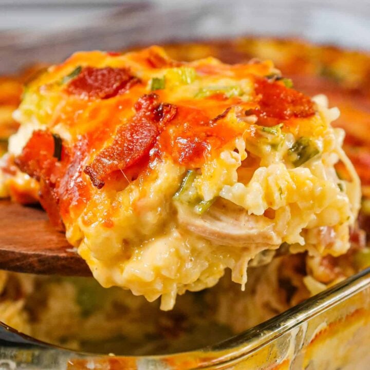 Chicken Bacon Ranch Casserole is a hearty chicken and rice casserole loaded with cream of chicken soup, cream of bacon soup, cheddar soup, ranch dressing mix, chopped bacon and shredded cheese.