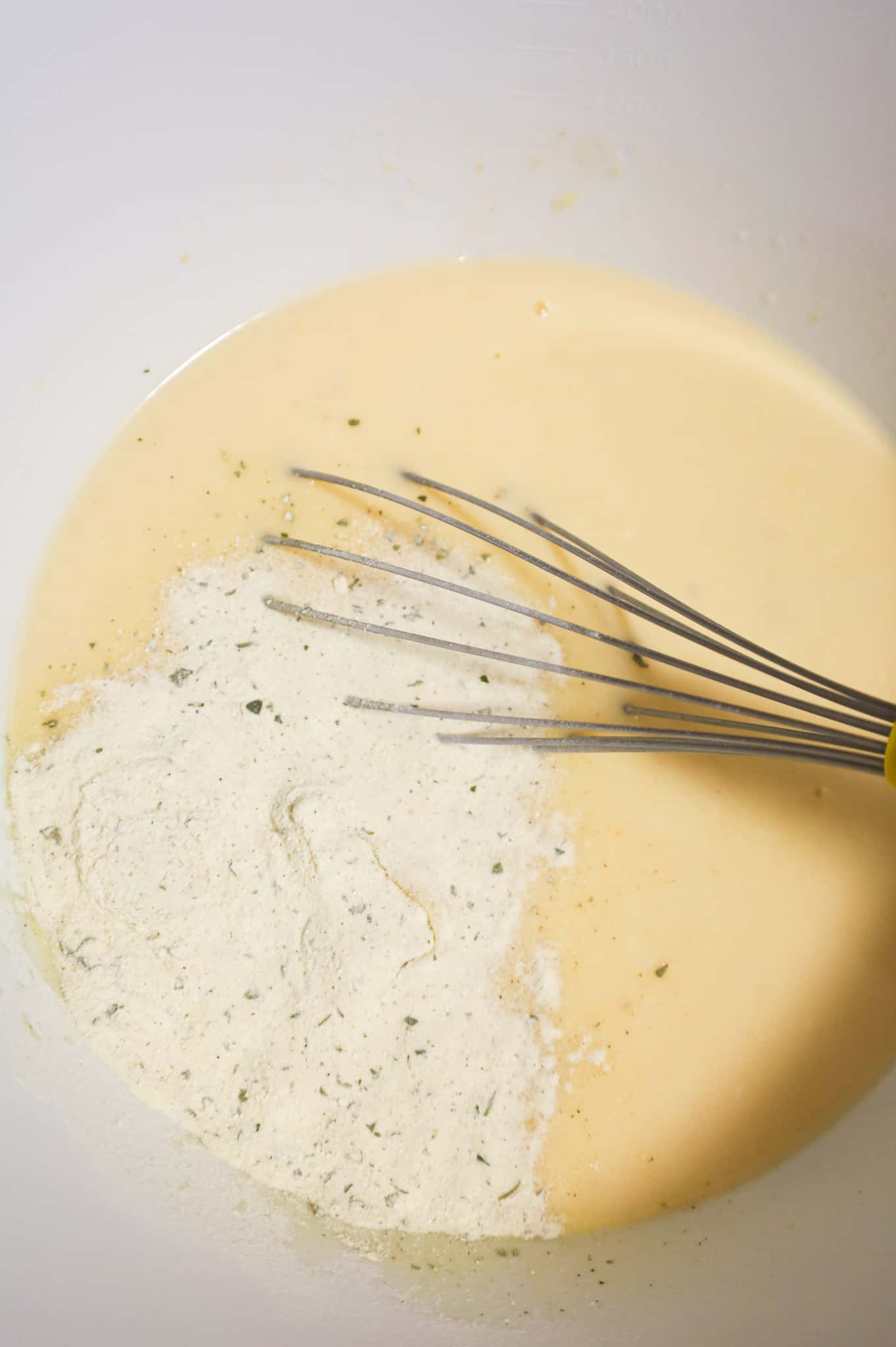 ranch dressing mix on top of cream soup mixture in a mixing bowl