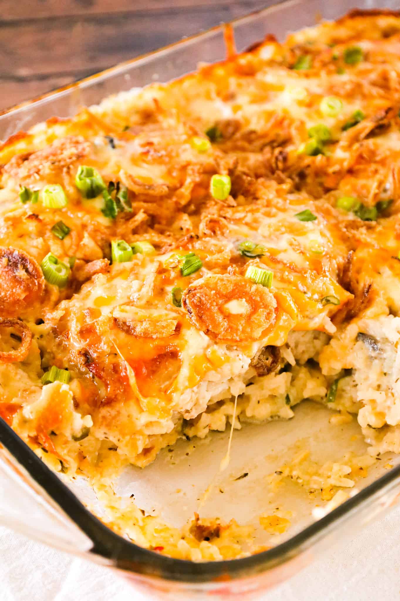 Pork Chop Casserole is a hearty one dish meal with a base of creamy instant rice topped with boneless pork chops, shredded cheese and crispy fried onions.