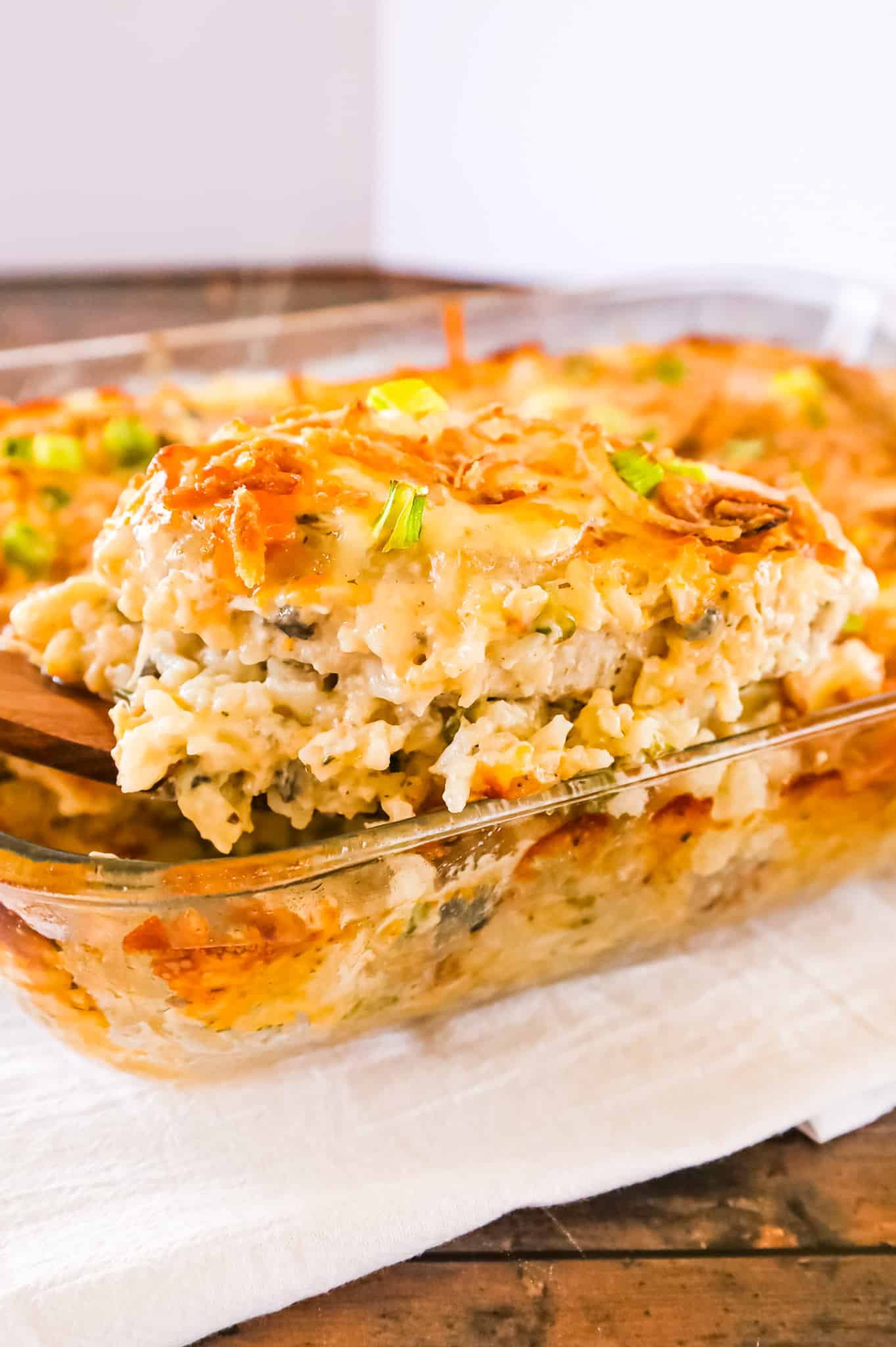 Pork Chop Casserole is a hearty one dish meal with a base of creamy instant rice topped with boneless pork chops, shredded cheese and crispy fried onions.