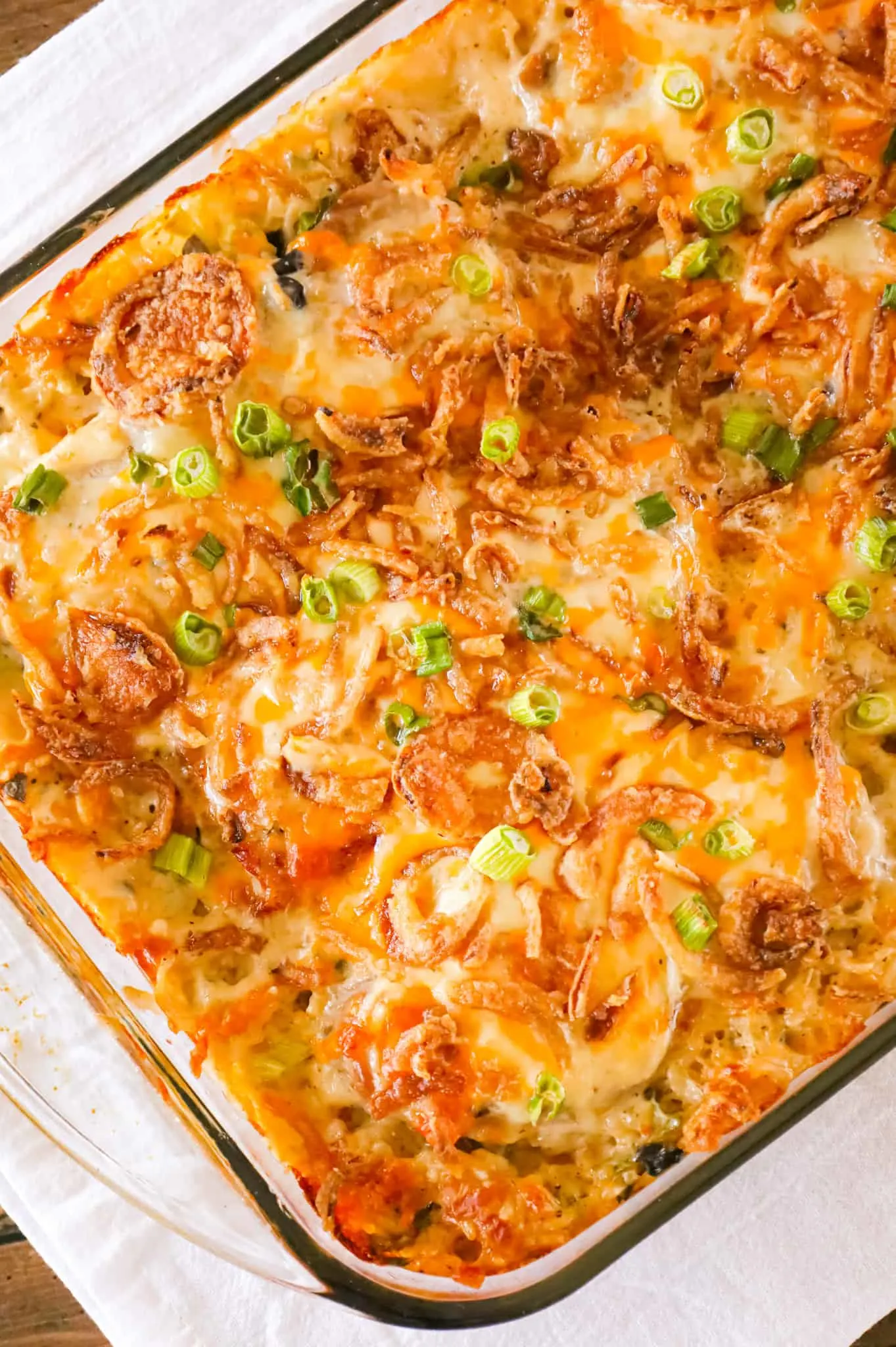 Pork Chop Casserole is a hearty one dish meal with a base of creamy instant rice topped with boneless pork chops, shredded cheese and crispy fried onions.