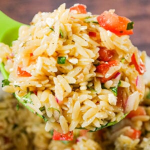 Bruschetta Orzo Pasta Salad is a tasty side dish recipe loaded with fresh diced tomatoes, red onions, fresh basil, garlic and feta cheese.