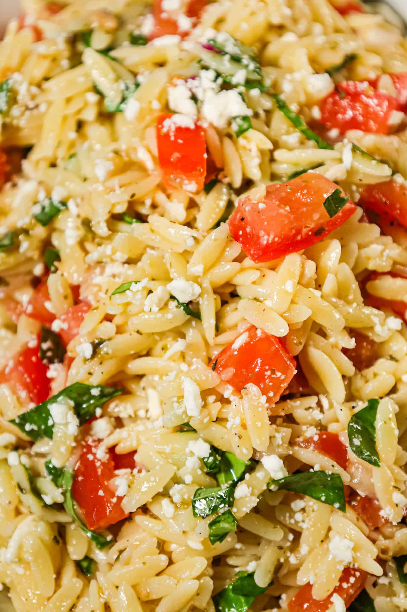 Bruschetta Orzo Pasta Salad is a tasty side dish recipe loaded with fresh diced tomatoes, red onions, fresh basil, garlic and feta cheese.