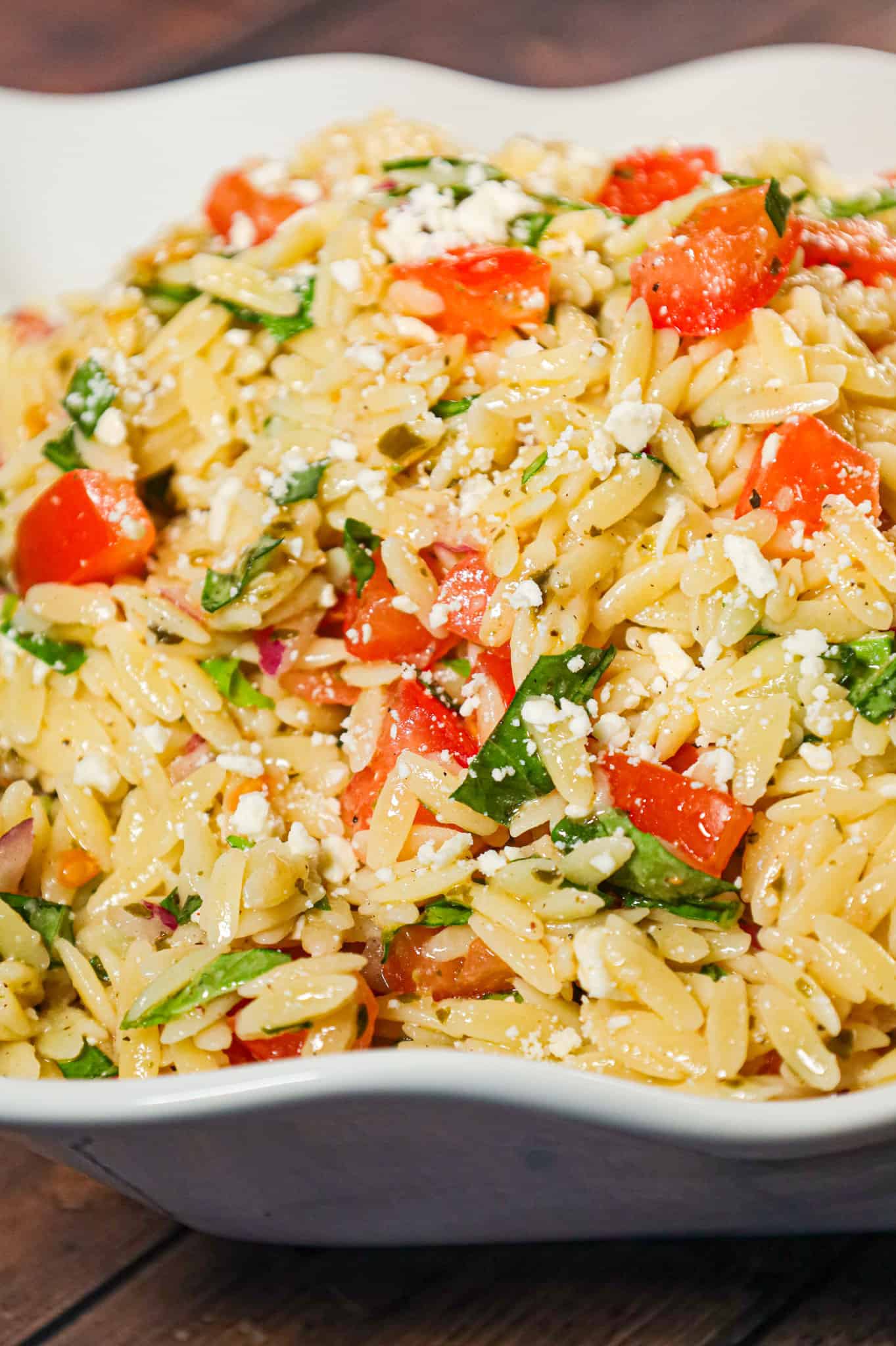 Bruschetta Orzo Pasta Salad is a tasty side dish recipe loaded with fresh diced tomatoes, red onions, fresh basil, garlic and feta cheese.