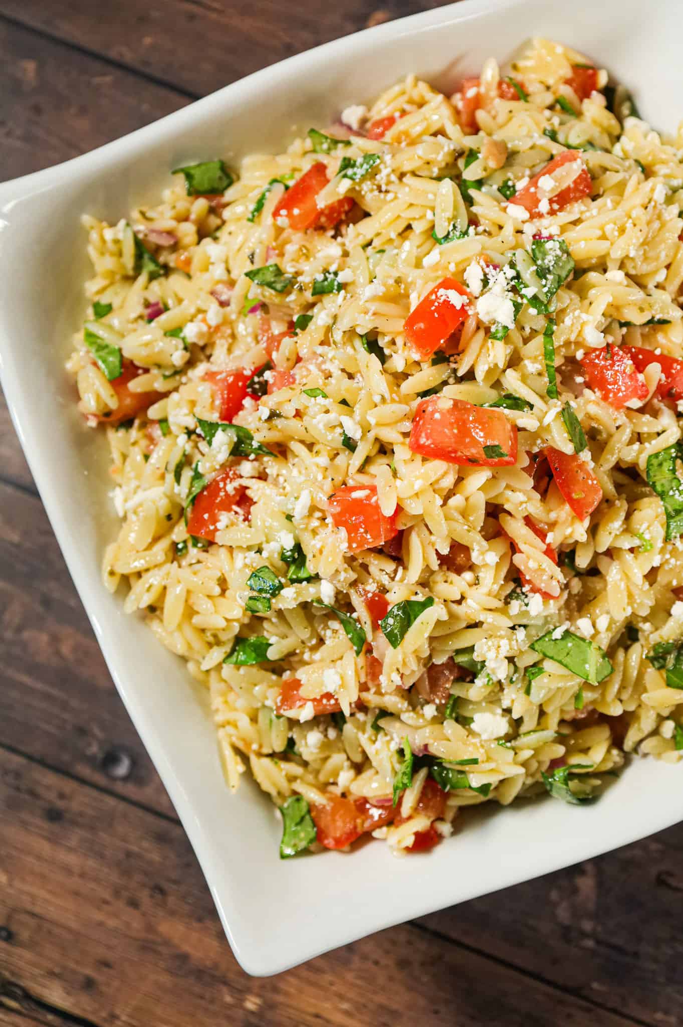 Bruschetta Orzo Pasta Salad is a tasty side dish recipe loaded with fresh diced tomatoes, red onions, fresh basil, garlic and feta cheese.