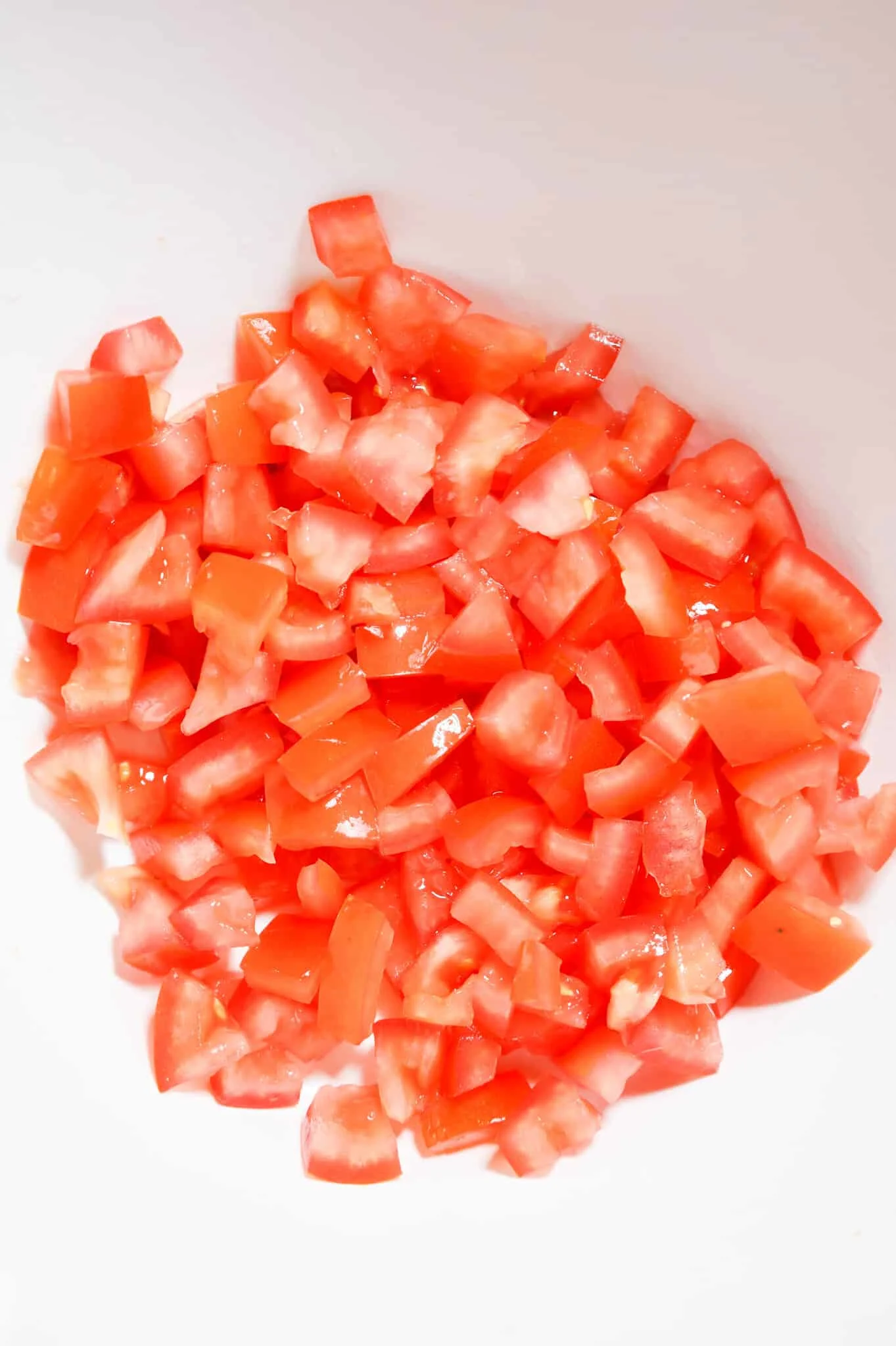 diced tomatoes in a mixing bowl