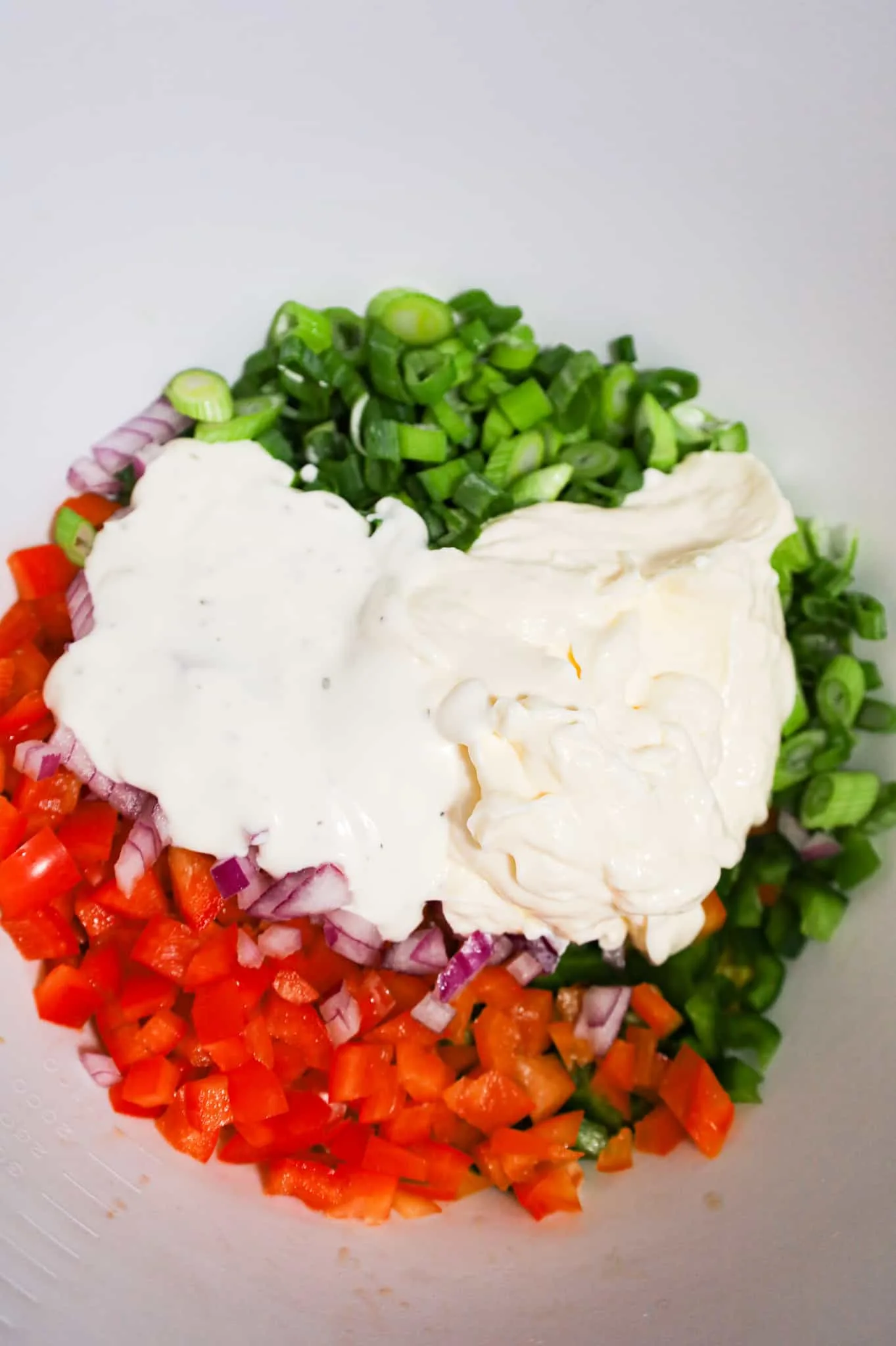 ranch dressing, mayo and diced veggies in a mixing bowl