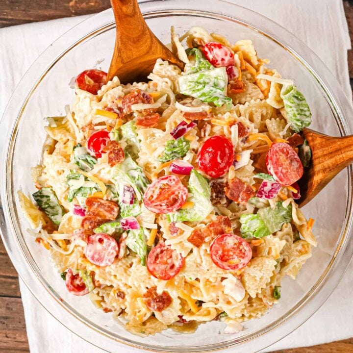 BLT Pasta Salad is a delicious cold side dish recipe made with bowtie pasta and loaded with chopped bacon, grape tomatoes, red onions and shredded cheese.