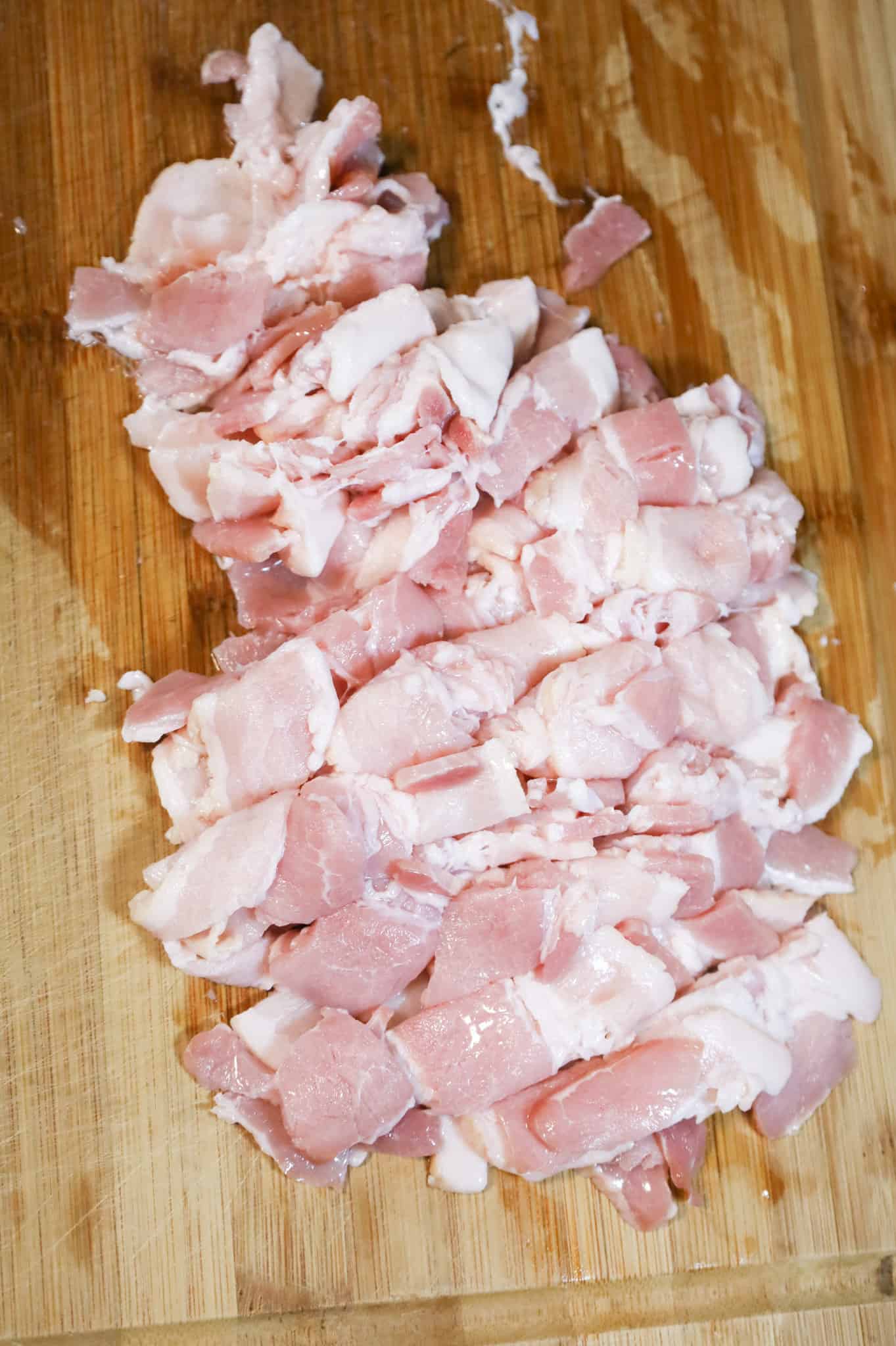 raw chopped bacon on a cutting board
