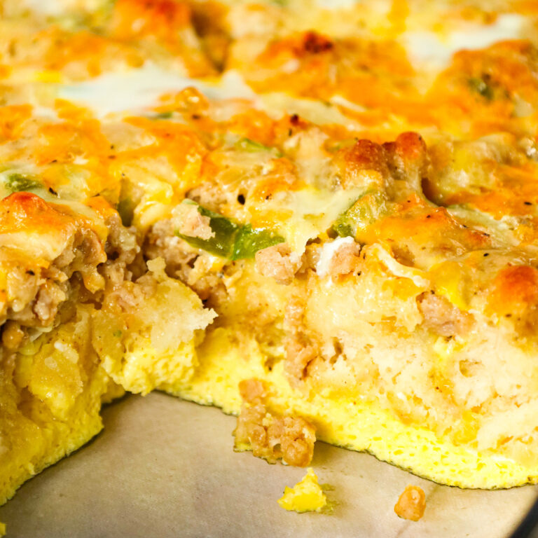 Breakfast Casserole with Biscuits is an easy breakfast dish loaded with sausage, egg, green peppers, Pillsbury biscuits and shredded cheese.