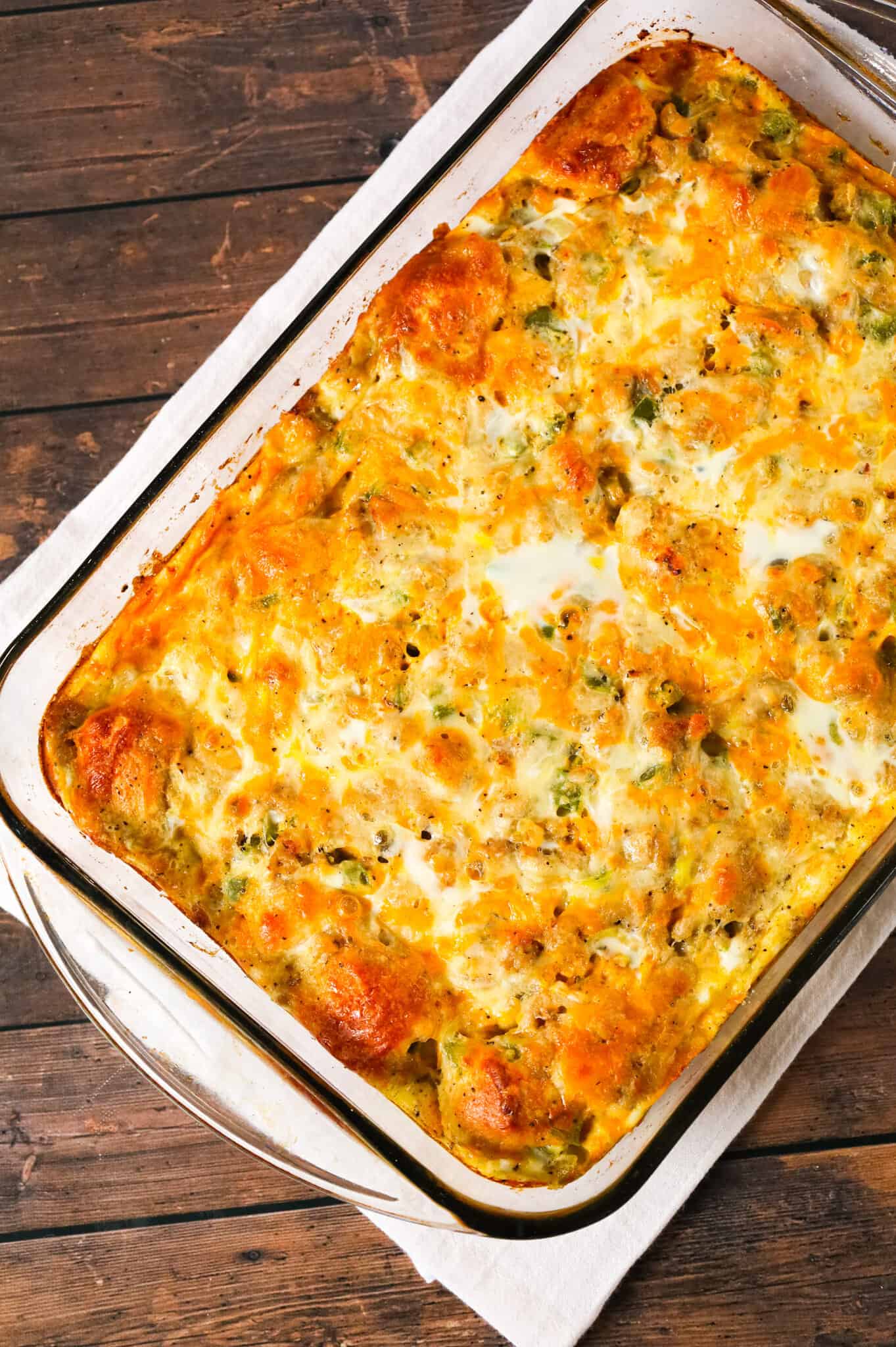 Breakfast Casserole with Biscuits is an easy breakfast dish loaded with sausage, egg, green peppers, Pillsbury biscuits and shredded cheese.