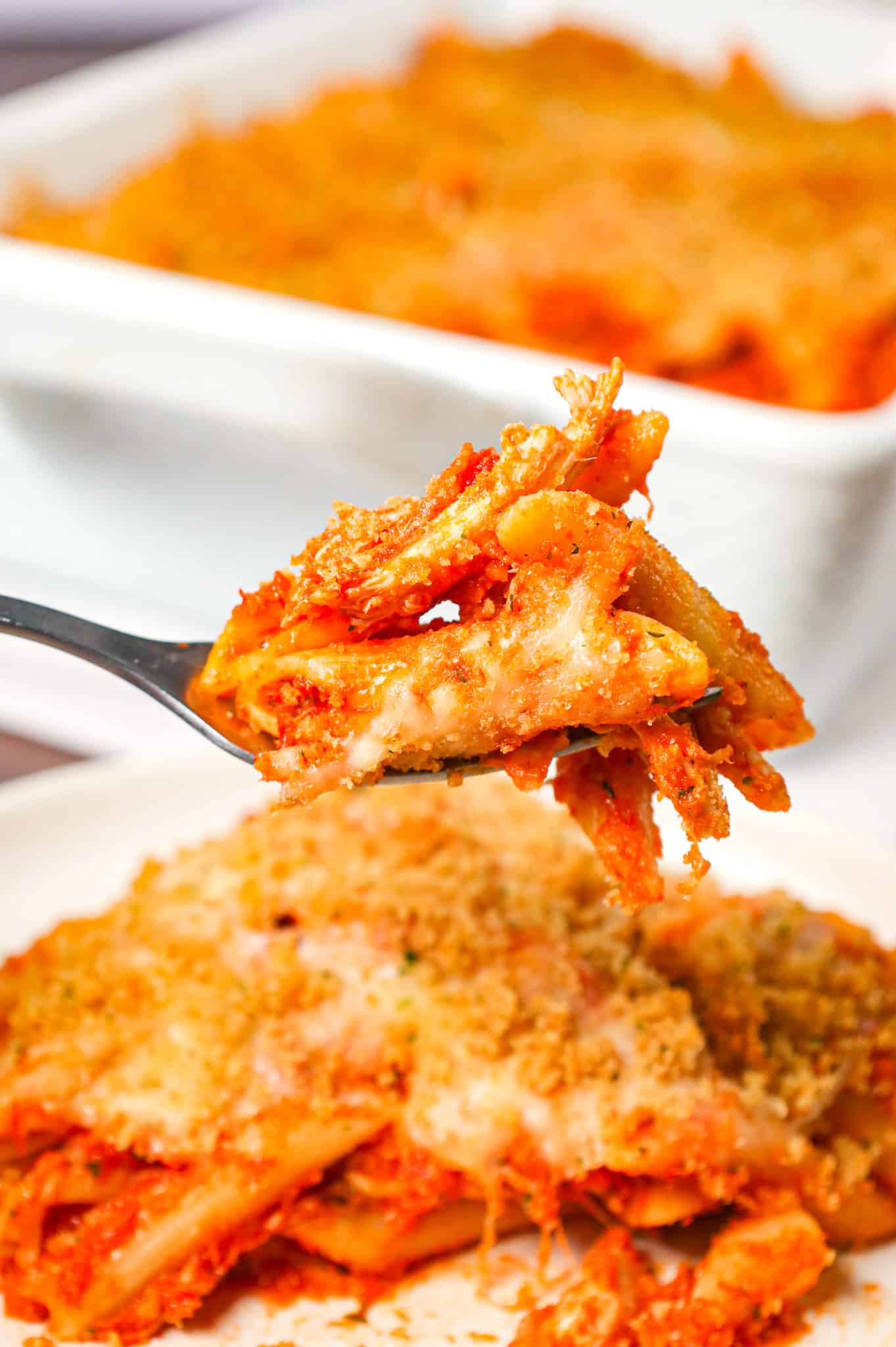 Chicken Parmesan Pasta is an easy baked pasta recipe loaded with shredded chicken, marinara sauce, mozzarella, parmesan cheese and topped with Italian seasoned bread crumbs.