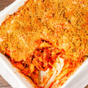 Chicken Parmesan Pasta is an easy baked pasta recipe loaded with shredded chicken, marinara sauce, mozzarella, parmesan cheese and topped with Italian seasoned bread crumbs.