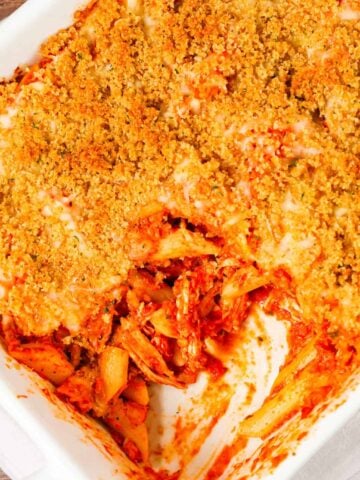 Chicken Parmesan Pasta is an easy baked pasta recipe loaded with shredded chicken, marinara sauce, mozzarella, parmesan cheese and topped with Italian seasoned bread crumbs.