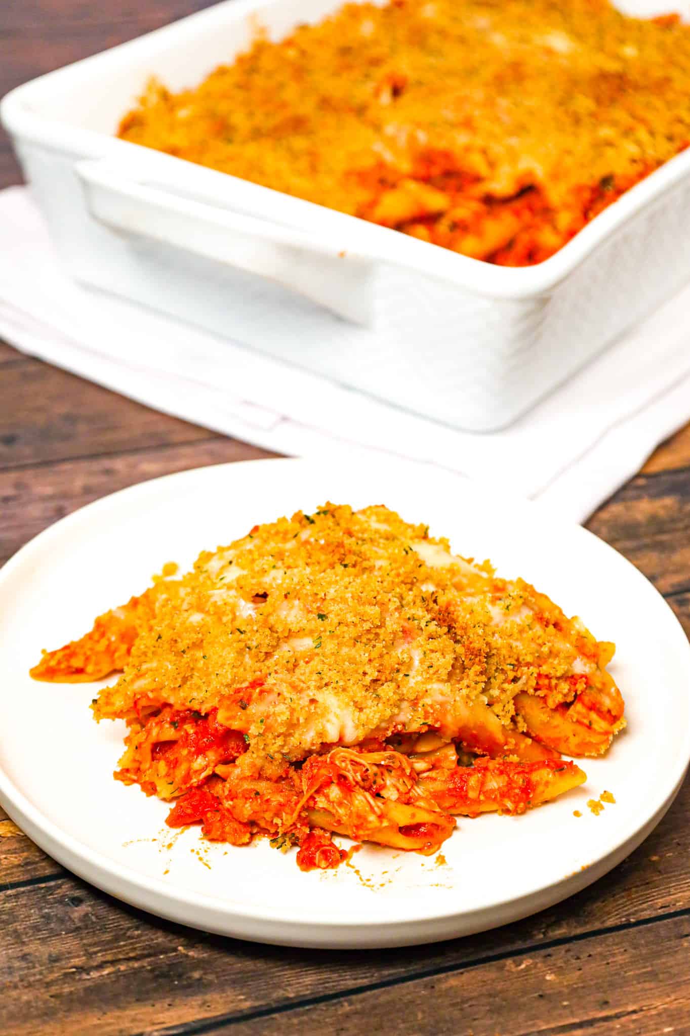 Chicken Parmesan Pasta is an easy baked pasta recipe loaded with shredded chicken, marinara sauce, mozzarella, parmesan cheese and topped with Italian seasoned bread crumbs.