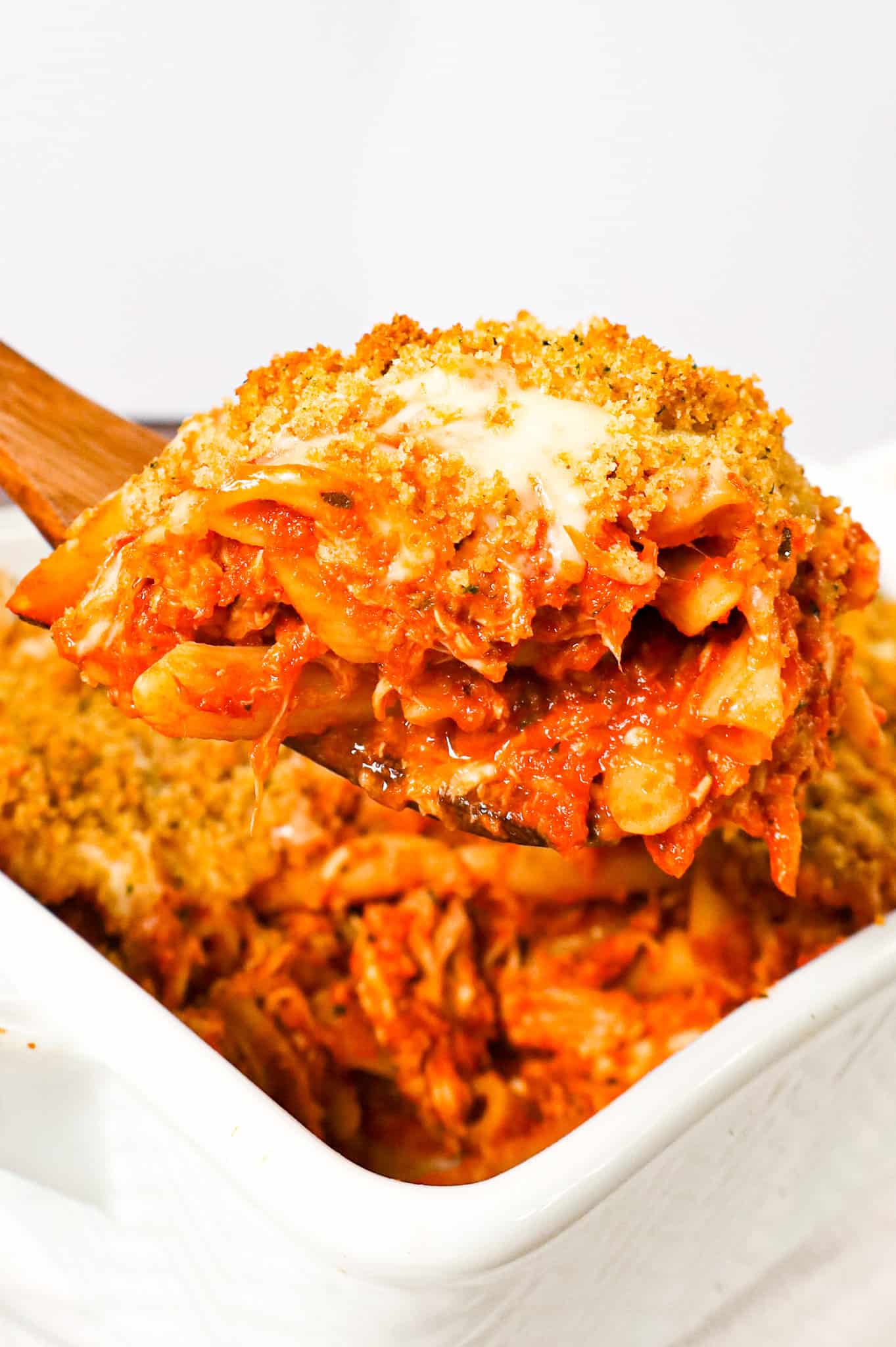 Chicken Parmesan Pasta is an easy baked pasta recipe loaded with shredded chicken, marinara sauce, mozzarella, parmesan cheese and topped with Italian seasoned bread crumbs.