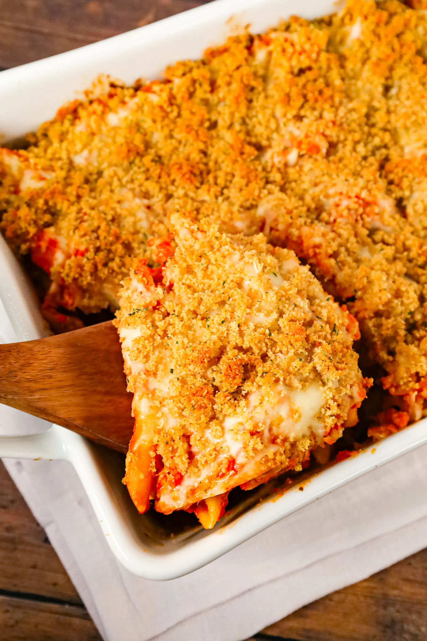 Chicken Parmesan Pasta is an easy baked pasta recipe loaded with shredded chicken, marinara sauce, mozzarella, parmesan cheese and topped with Italian seasoned bread crumbs.
