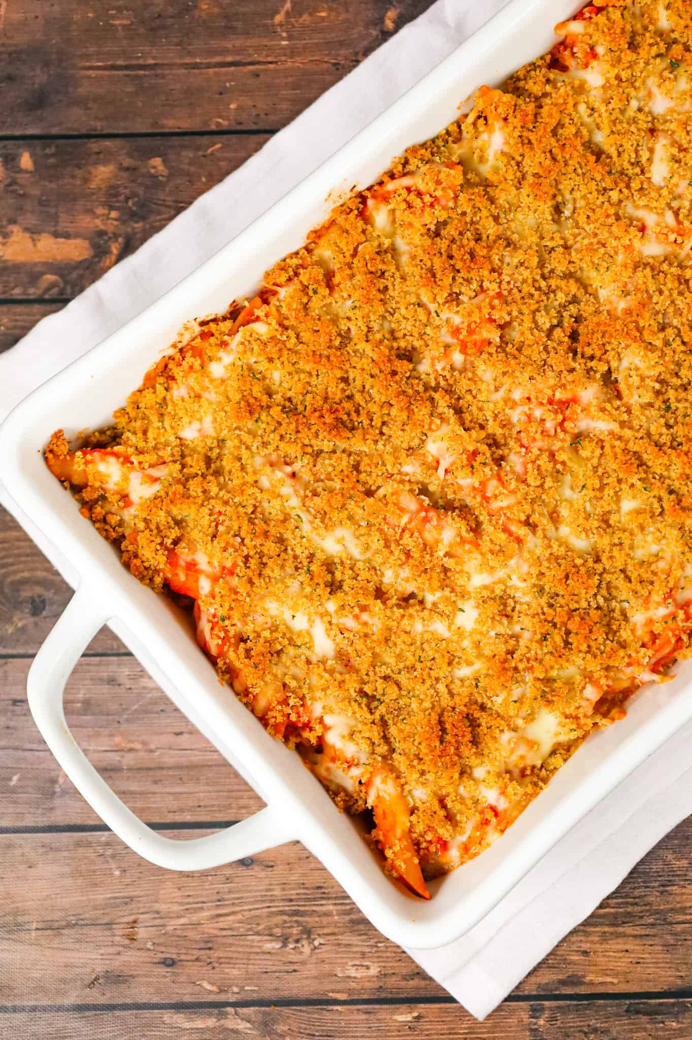 Chicken Parmesan Pasta is an easy baked pasta recipe loaded with shredded chicken, marinara sauce, mozzarella, parmesan cheese and topped with Italian seasoned bread crumbs.