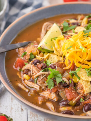 Chicken Taco Soup is a hearty soup recipe loaded with shredded chicken, black beans, corn, tomatoes and spices.