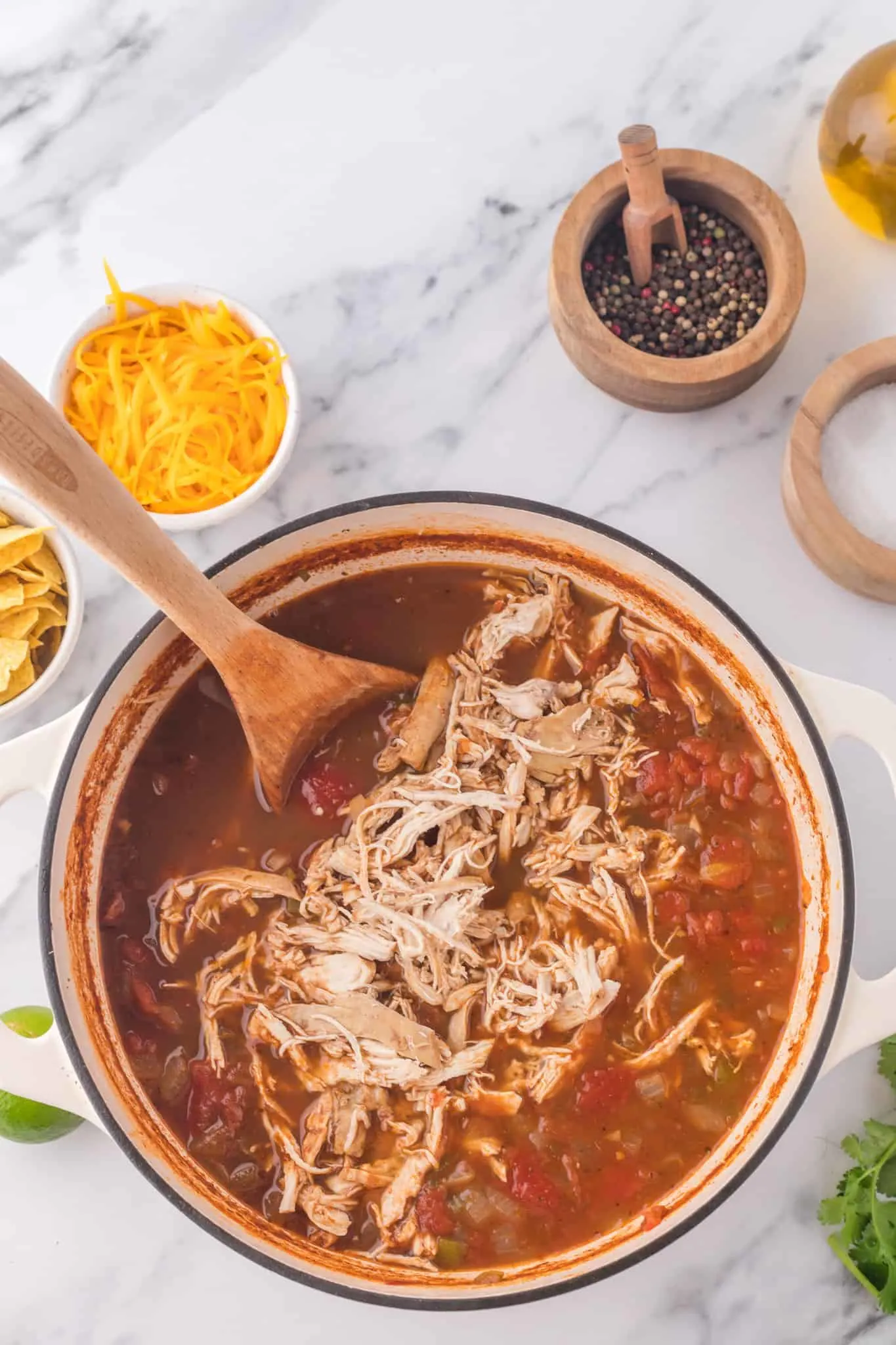 shredded chicken breast added to pot of taco soup