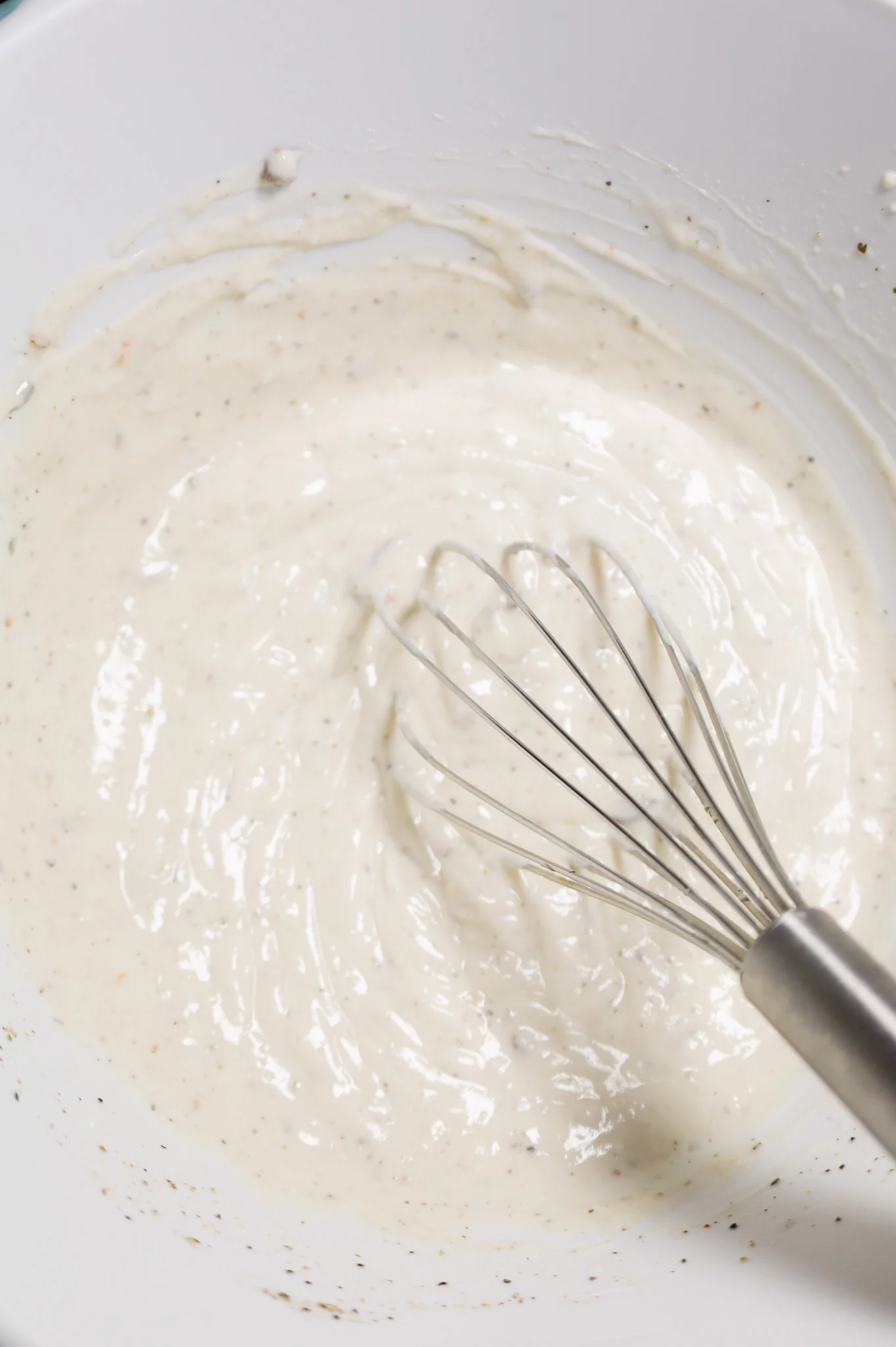 cream of mushroom soup, milk and sour cream whisked together in a mixing bowl