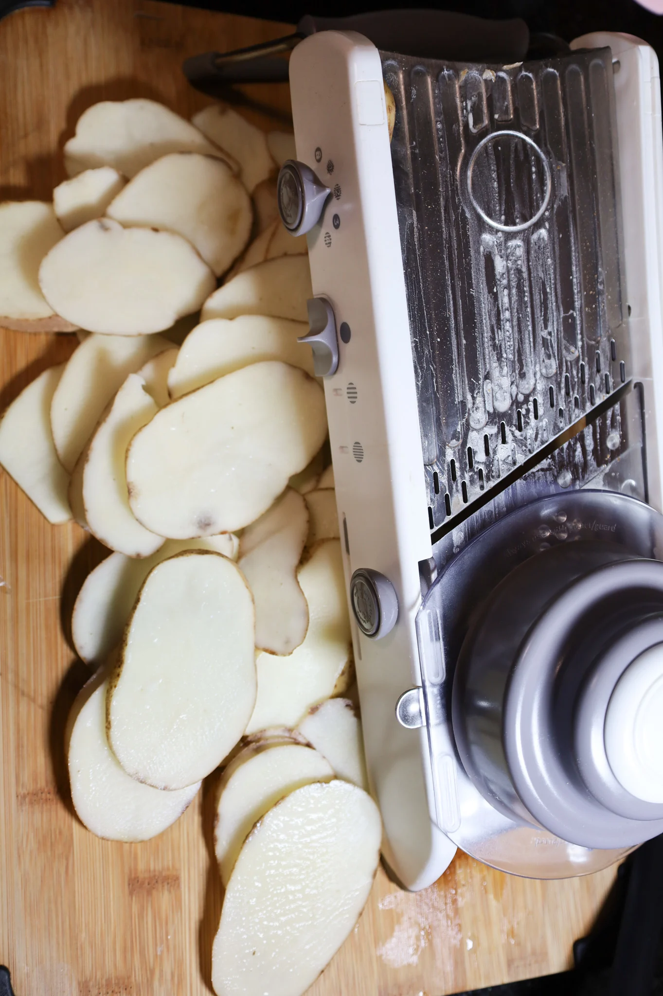 sliced potatoes on a cutting board