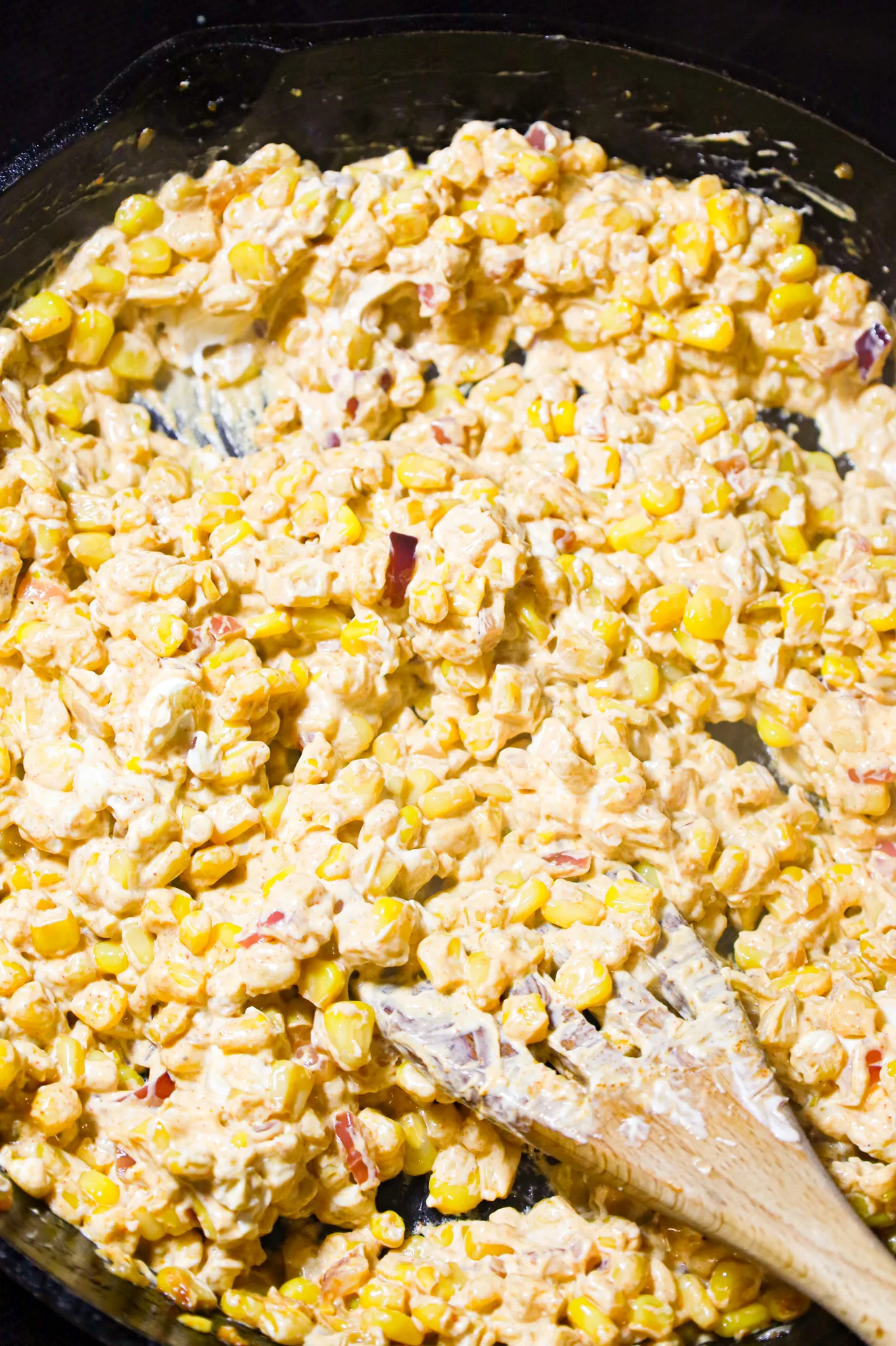 melted cream cheese and corn mixture in a skillet