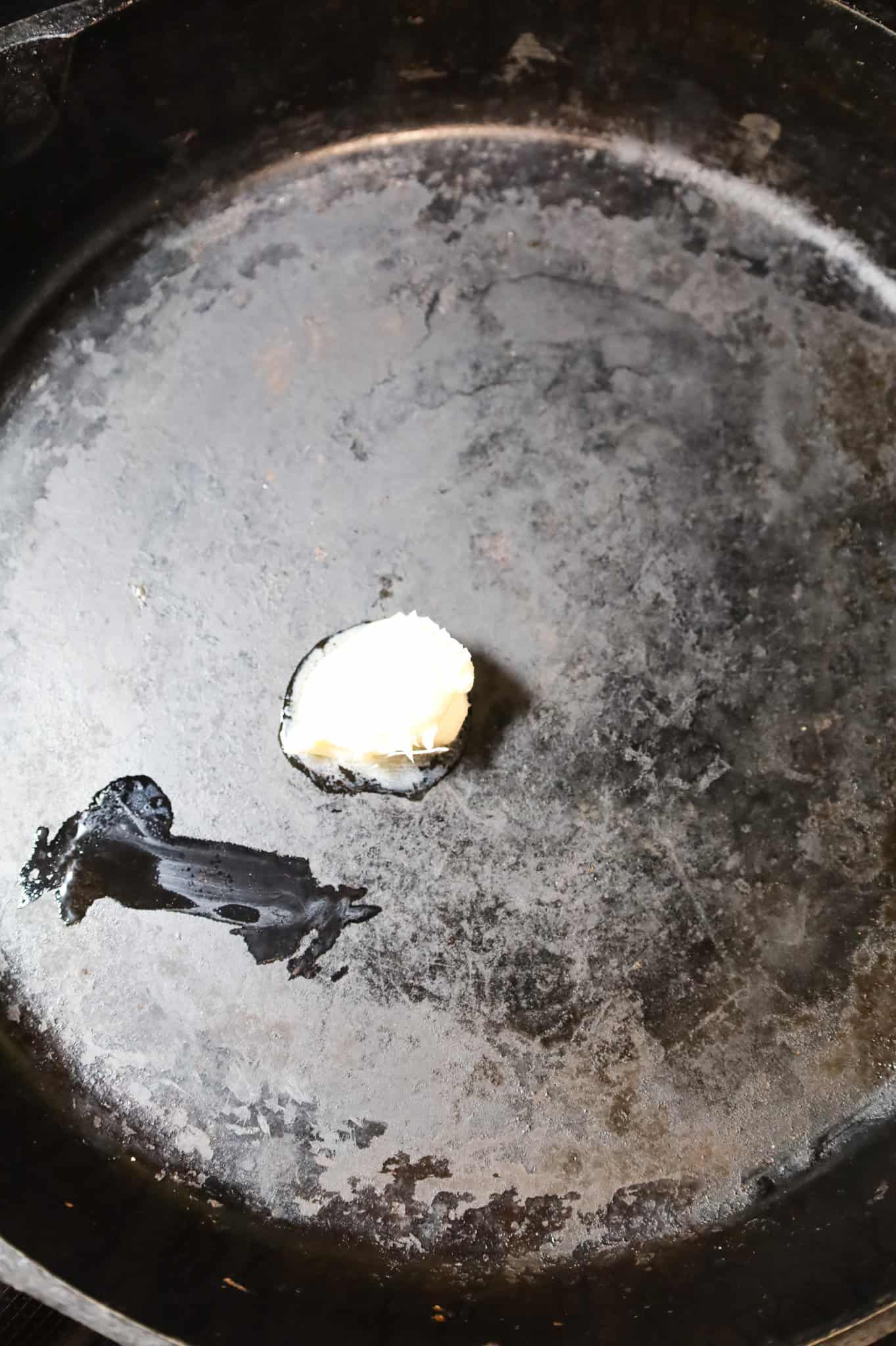 butter added to a cast iron skillet