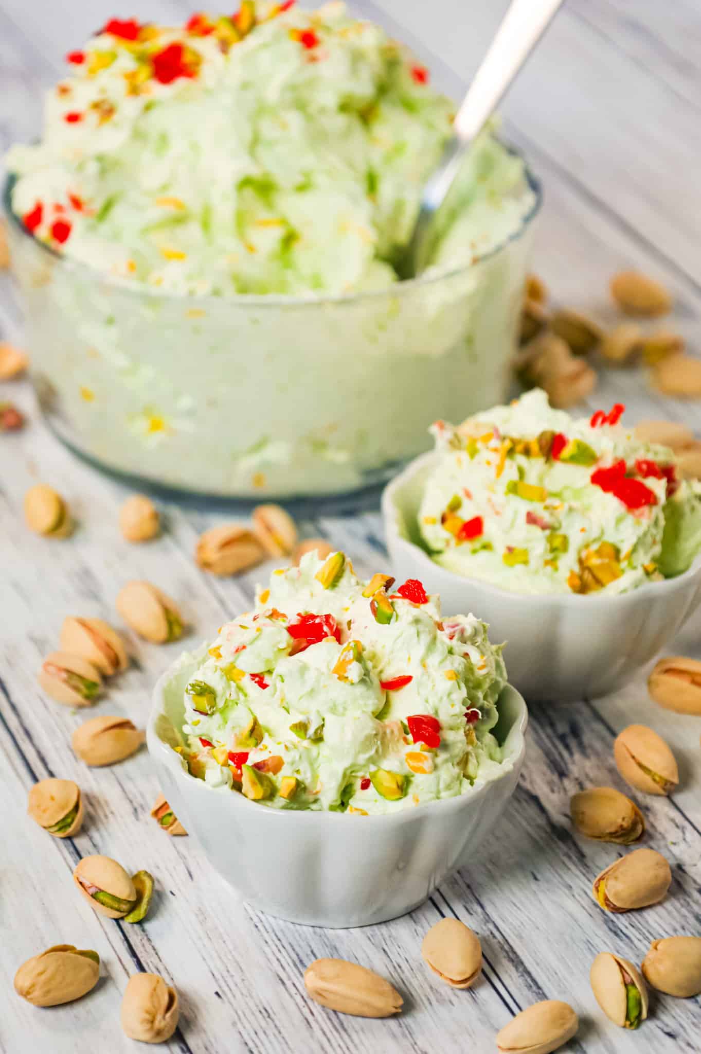 Pistachio Fluff Salad is a delicious side dish or dessert recipe loaded with crushed pineapple, mandarin segments, pistachio pudding mix, mini marshmallows and Cool Whip.