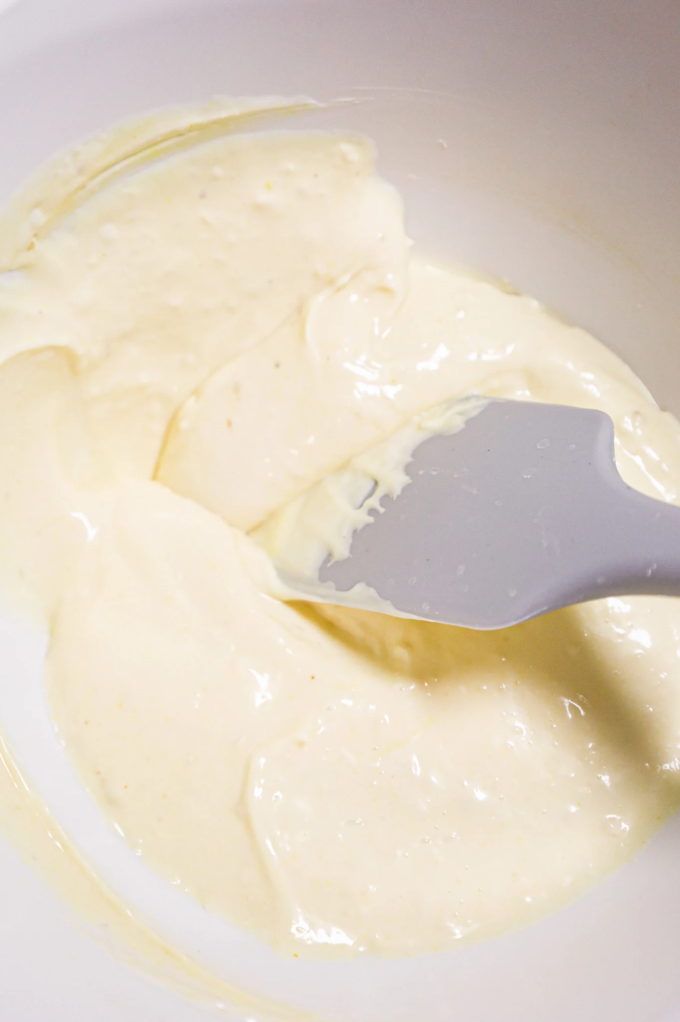 stirring together mayo, horseradish sauce and mustard in a mixing bowl