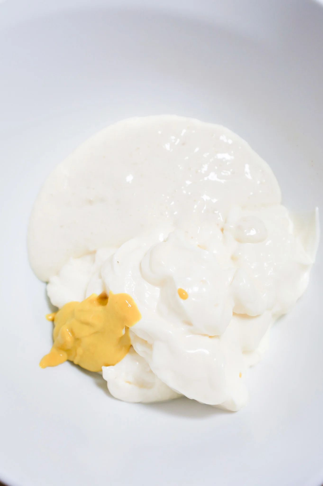 mustard, horseradish sauce and mayo in a mixing bowl